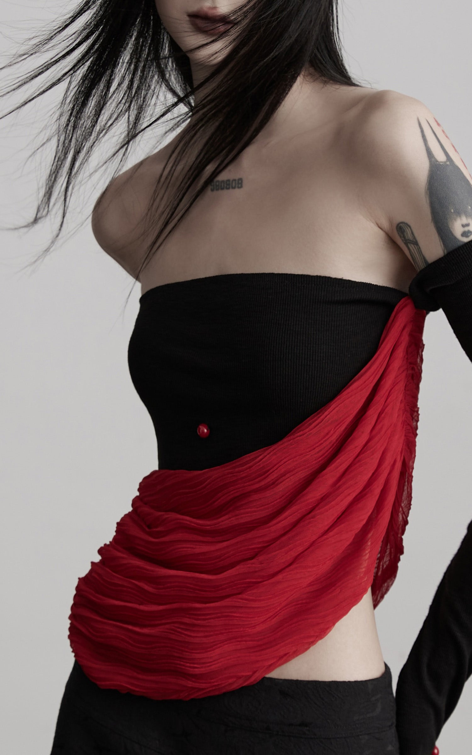 DOINDULGE Asymmetric Drape Top — Sculptural Red Pleats with Black Knit Base
