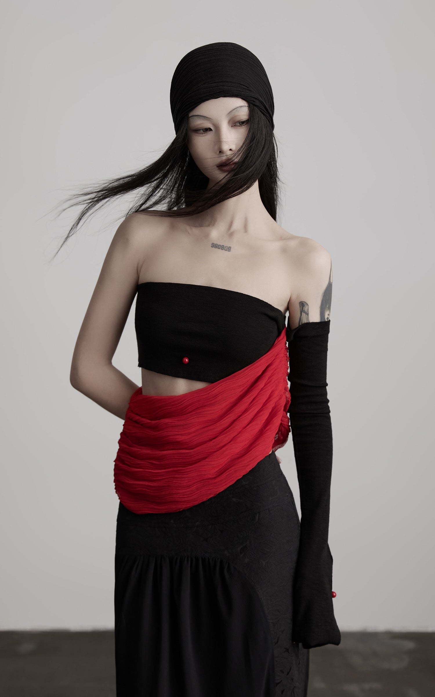 DOINDULGE Asymmetric Drape Top — Sculptural Red Pleats with Black Knit Base