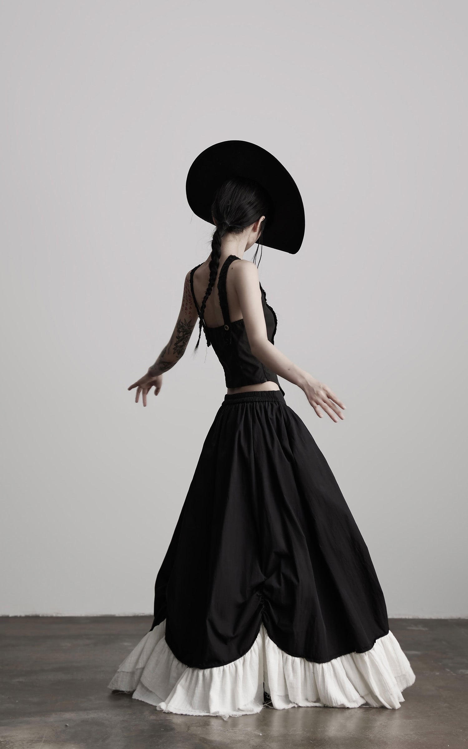 DOINDULGE Layered Contrast Hem Skirt with Gathered Draping and Buttoned High Waist