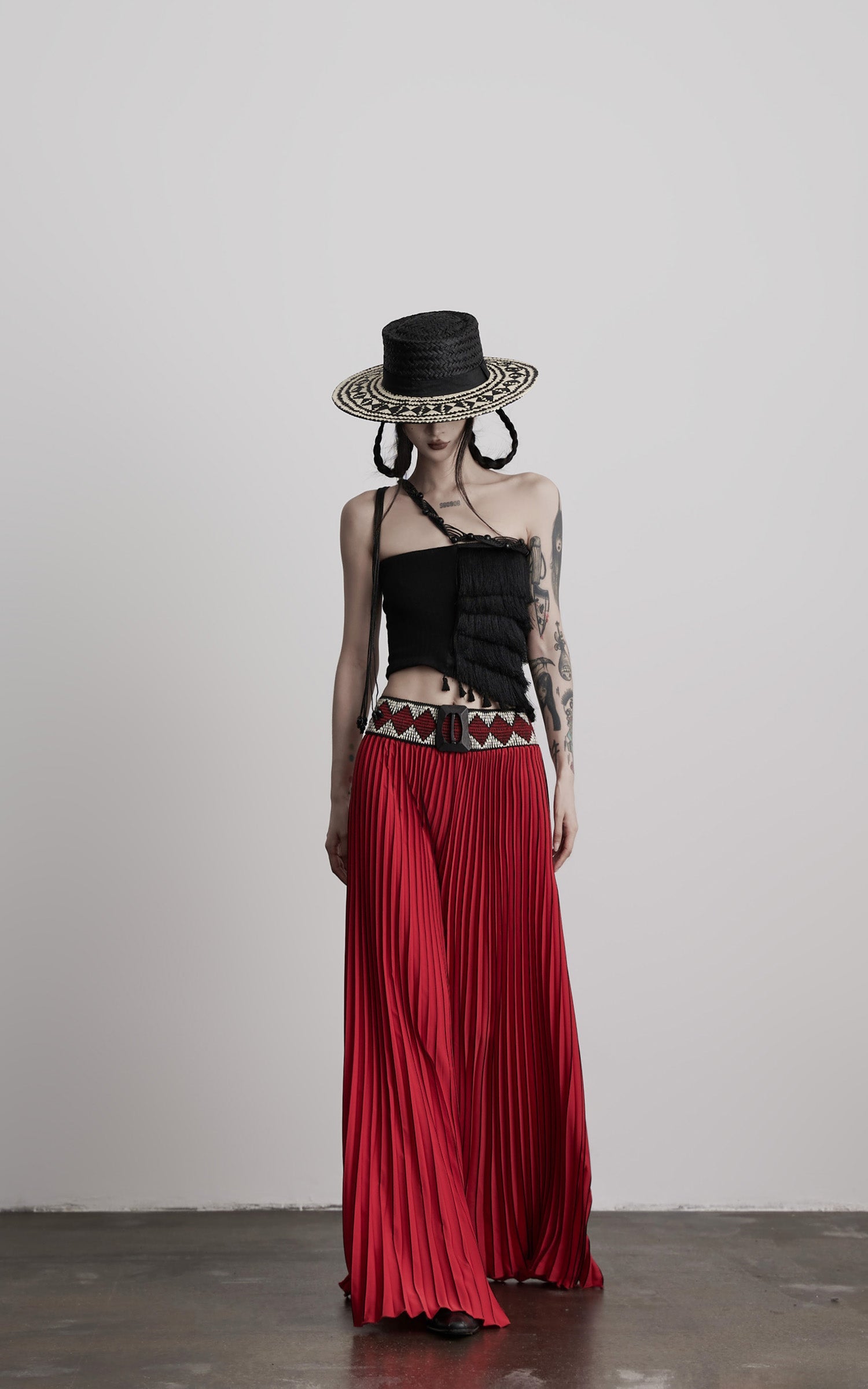 DOINDULGE Red Pleated Wide-Leg Skirt with Geometric Woven Waistband and Statement Buckle