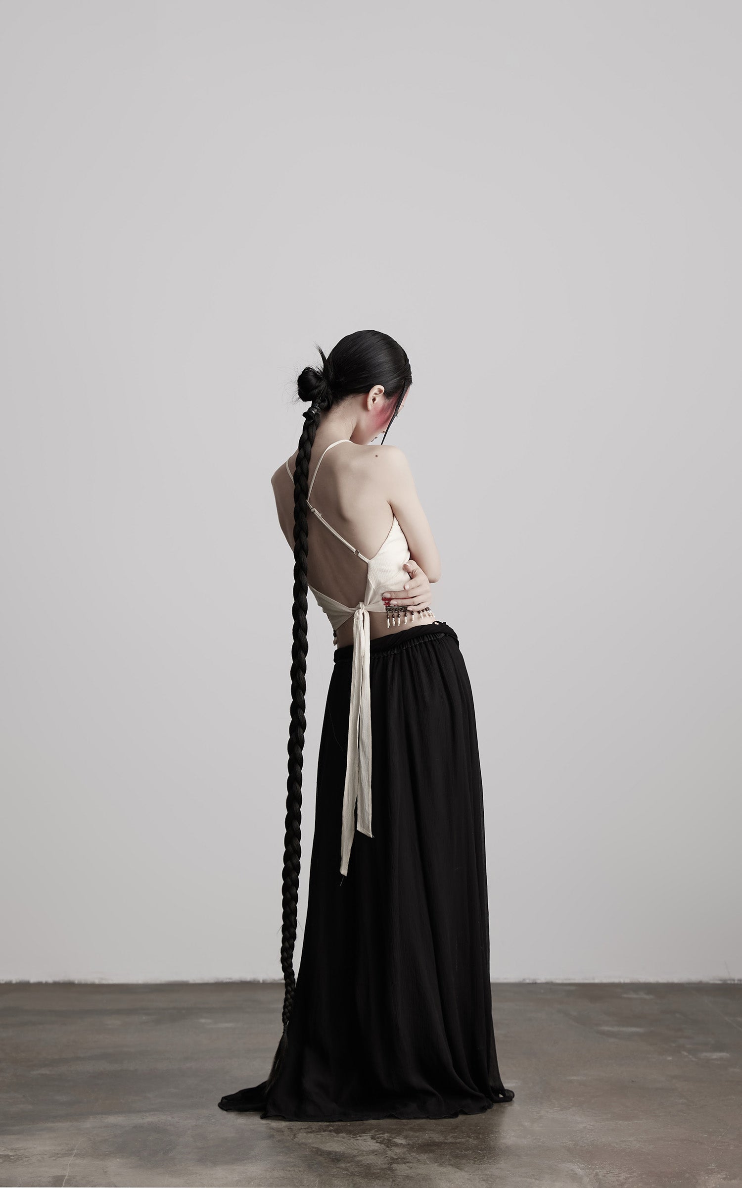 DOINDULGE Embroidered Halter Top with Floral Motif and Beaded Hem Detailing
