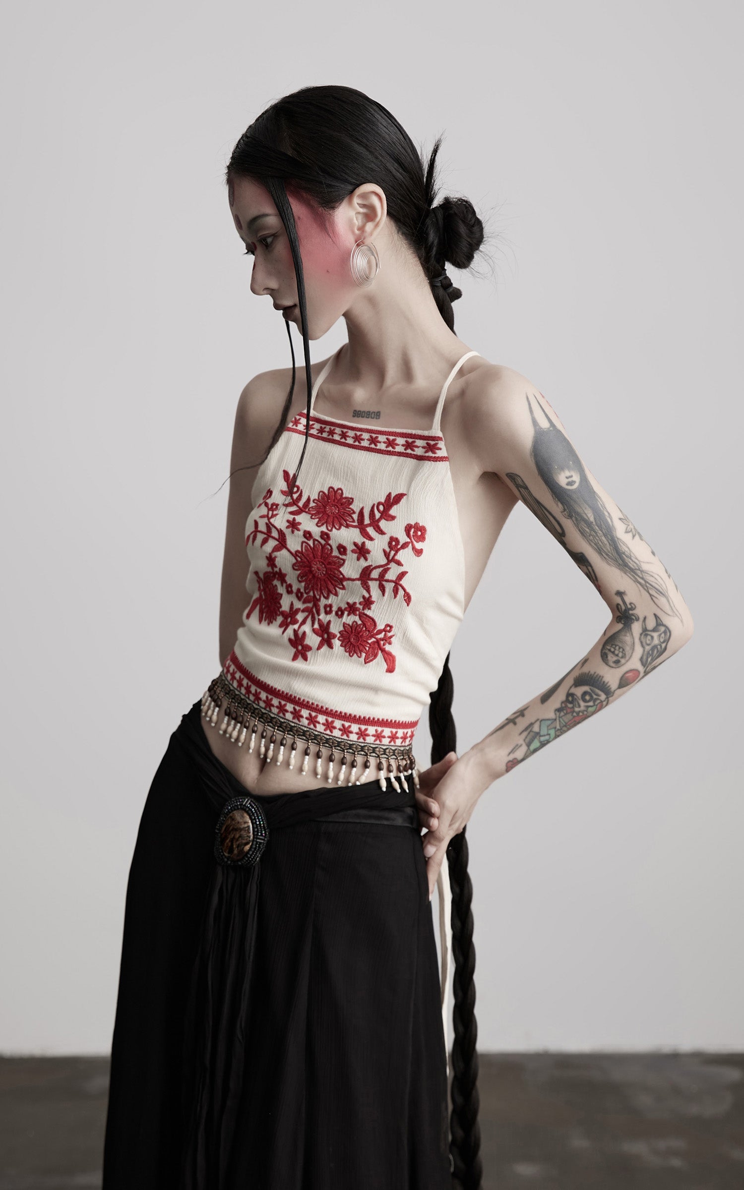 DOINDULGE Embroidered Halter Top with Floral Motif and Beaded Hem Detailing