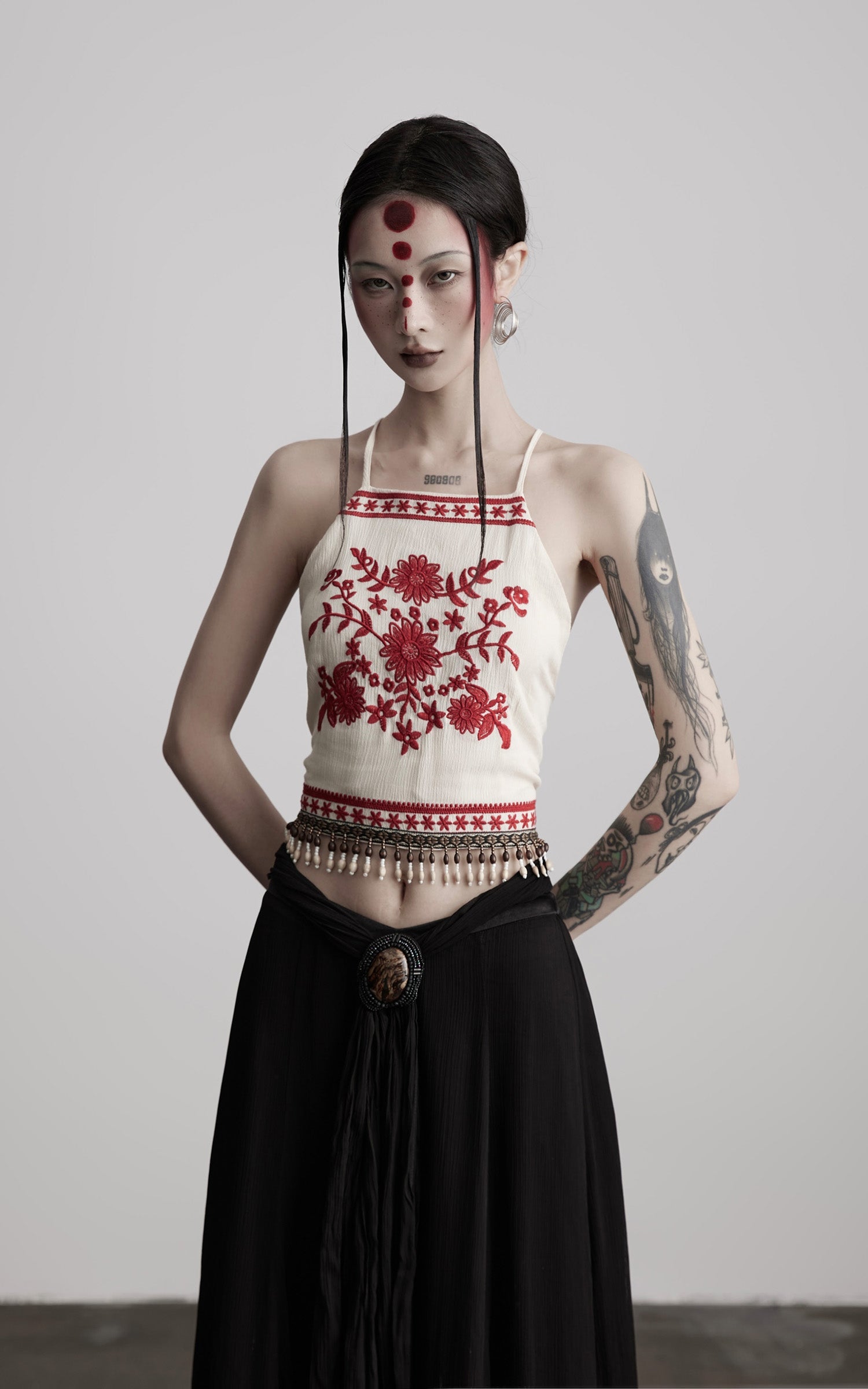 DOINDULGE Embroidered Halter Top with Floral Motif and Beaded Hem Detailing