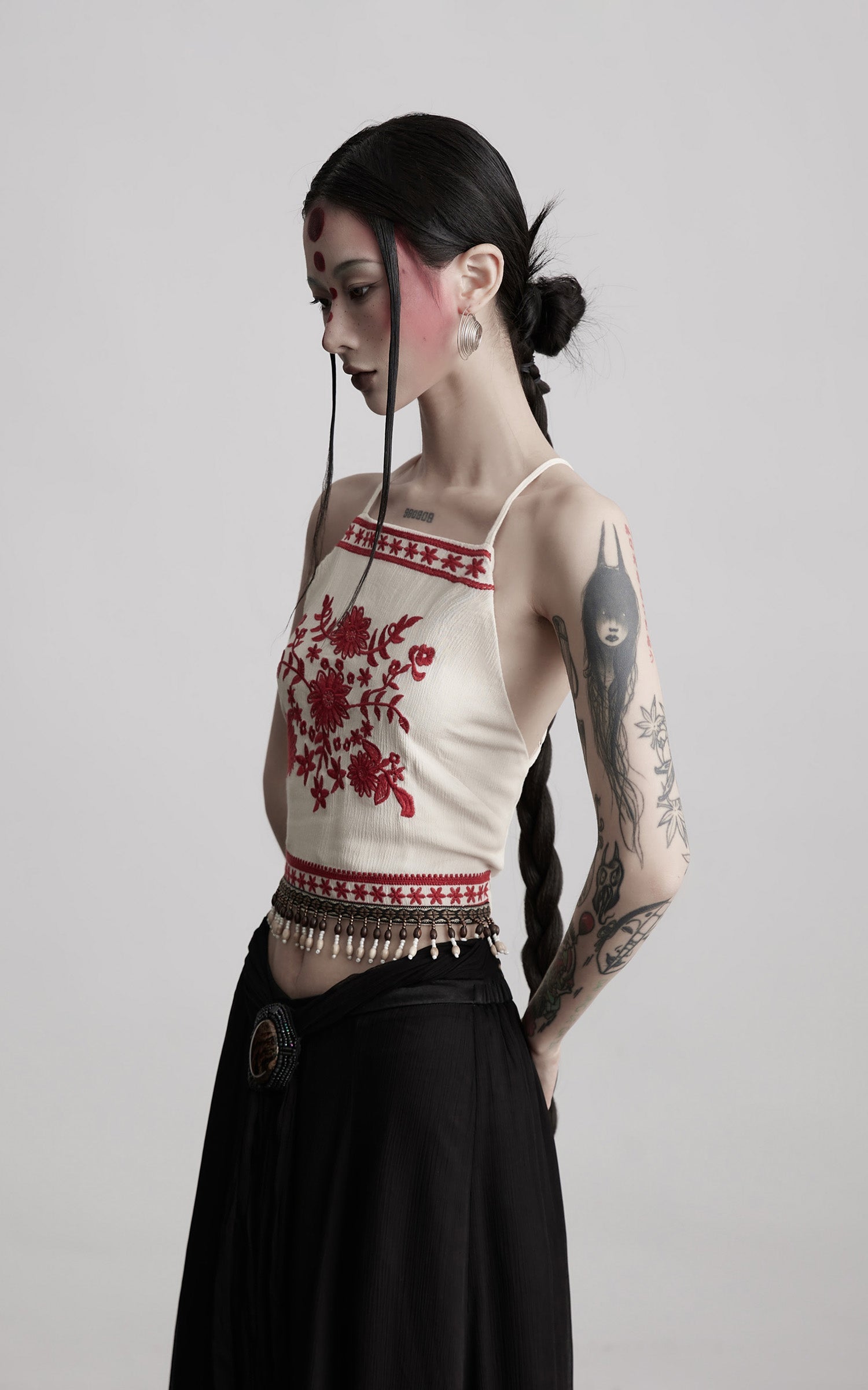 DOINDULGE Embroidered Halter Top with Floral Motif and Beaded Hem Detailing