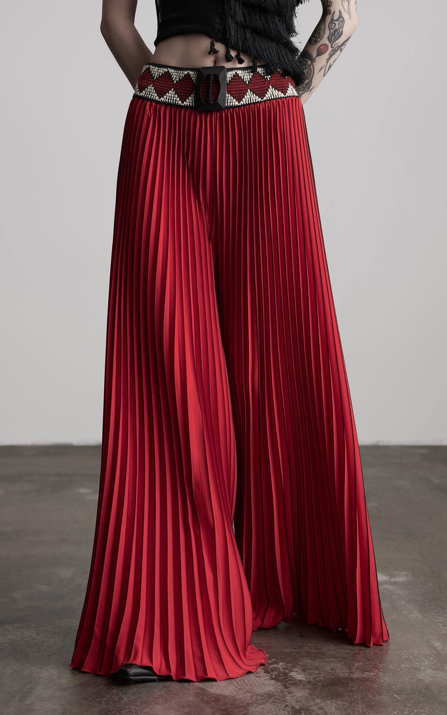 DOINDULGE Red Pleated Wide-Leg Skirt with Geometric Woven Waistband and Statement Buckle