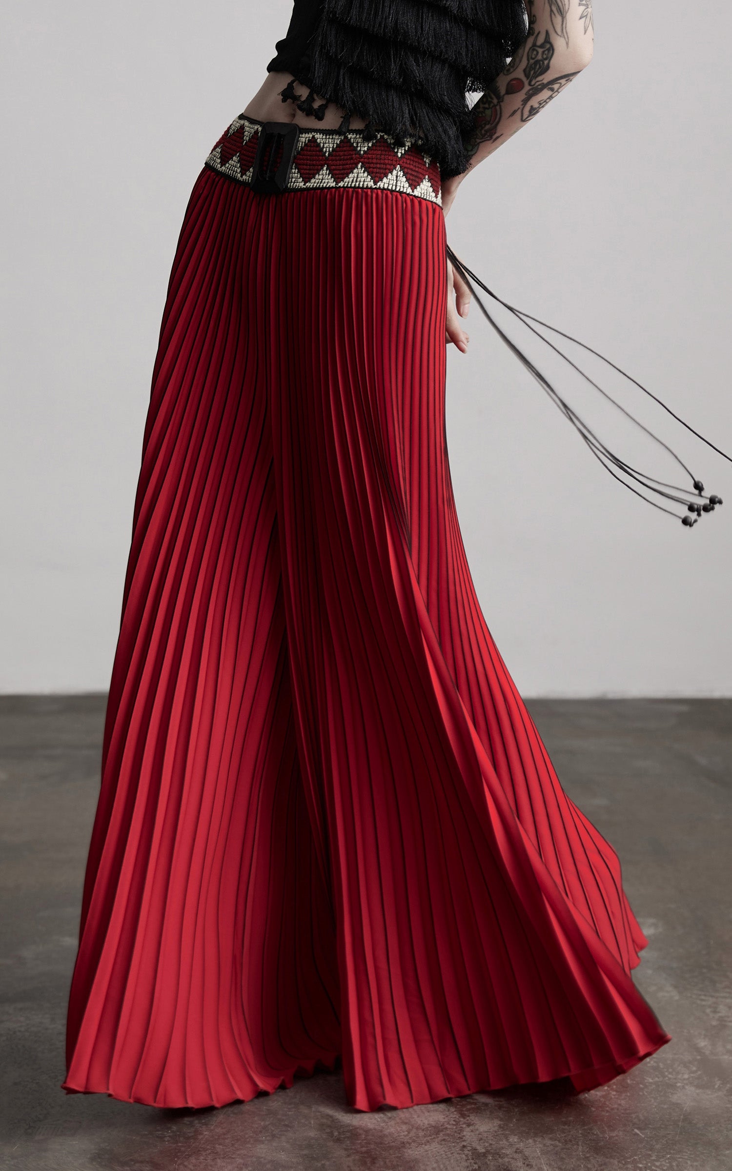 DOINDULGE Red Pleated Wide-Leg Skirt with Geometric Woven Waistband and Statement Buckle