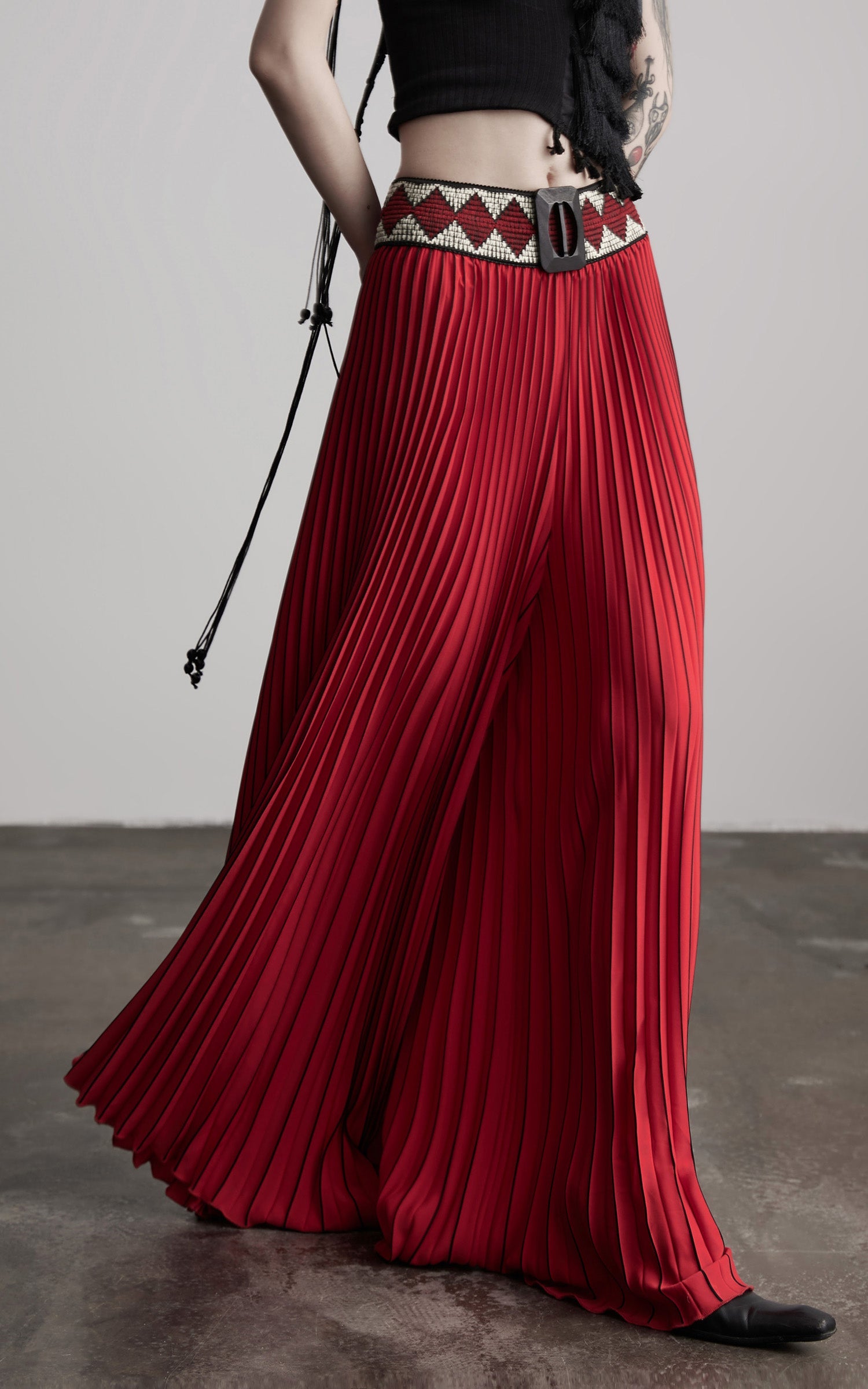 DOINDULGE Red Pleated Wide-Leg Skirt with Geometric Woven Waistband and Statement Buckle