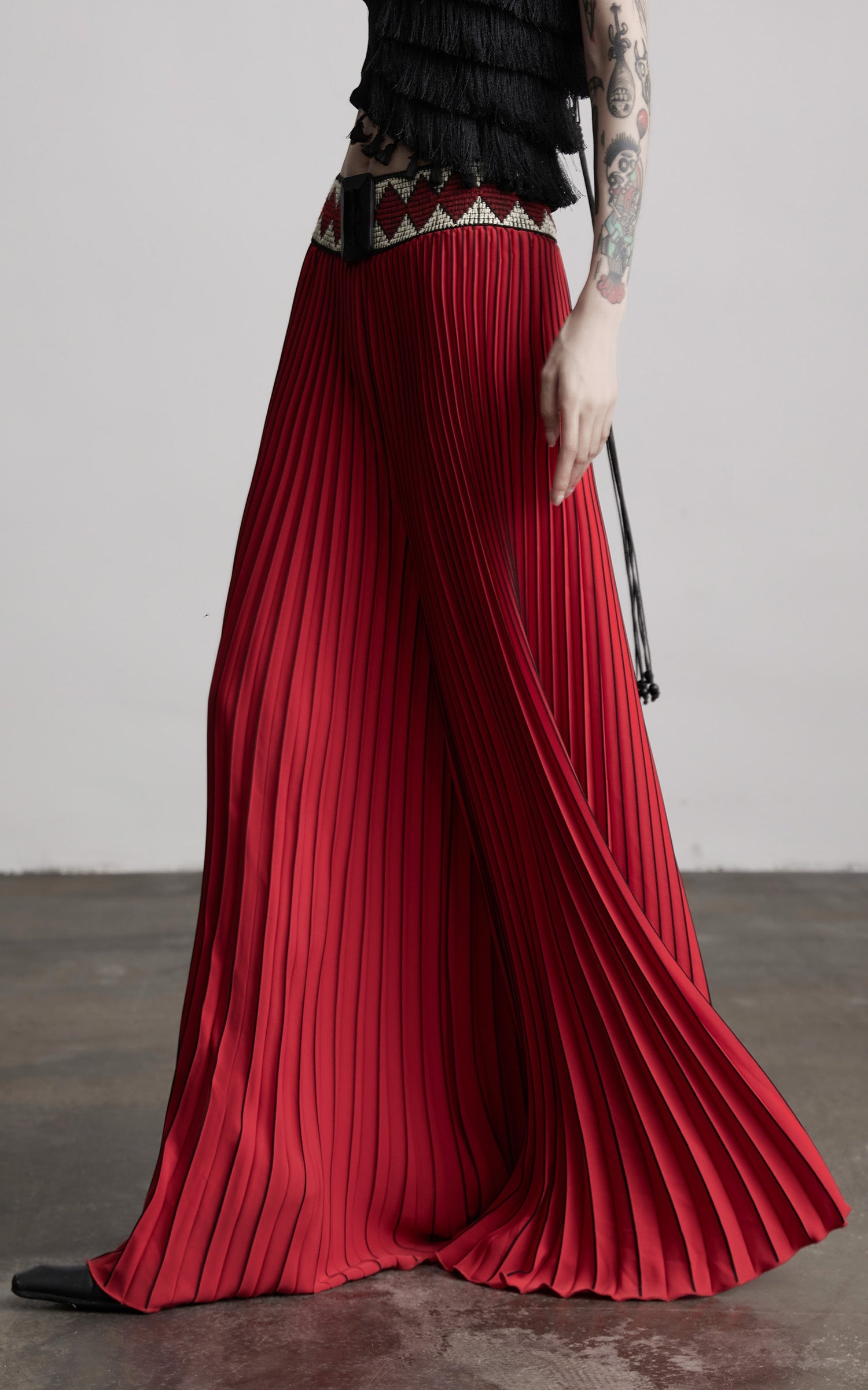 DOINDULGE Red Pleated Wide-Leg Skirt with Geometric Woven Waistband and Statement Buckle
