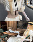 Rase le sol Cropped Puff-Sleeve Shirt with Pleated Front and Rosette Tie
