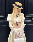 Rase le sol Cropped Puff-Sleeve Shirt with Pleated Front and Rosette Tie