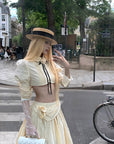 Rase le sol Cropped Puff-Sleeve Shirt with Pleated Front and Rosette Tie