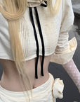 Rase le sol Cropped Puff-Sleeve Shirt with Pleated Front and Rosette Tie