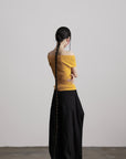 DOINDULGE Off-Shoulder Ribbed Knit Top with Wooden Medallion Detail