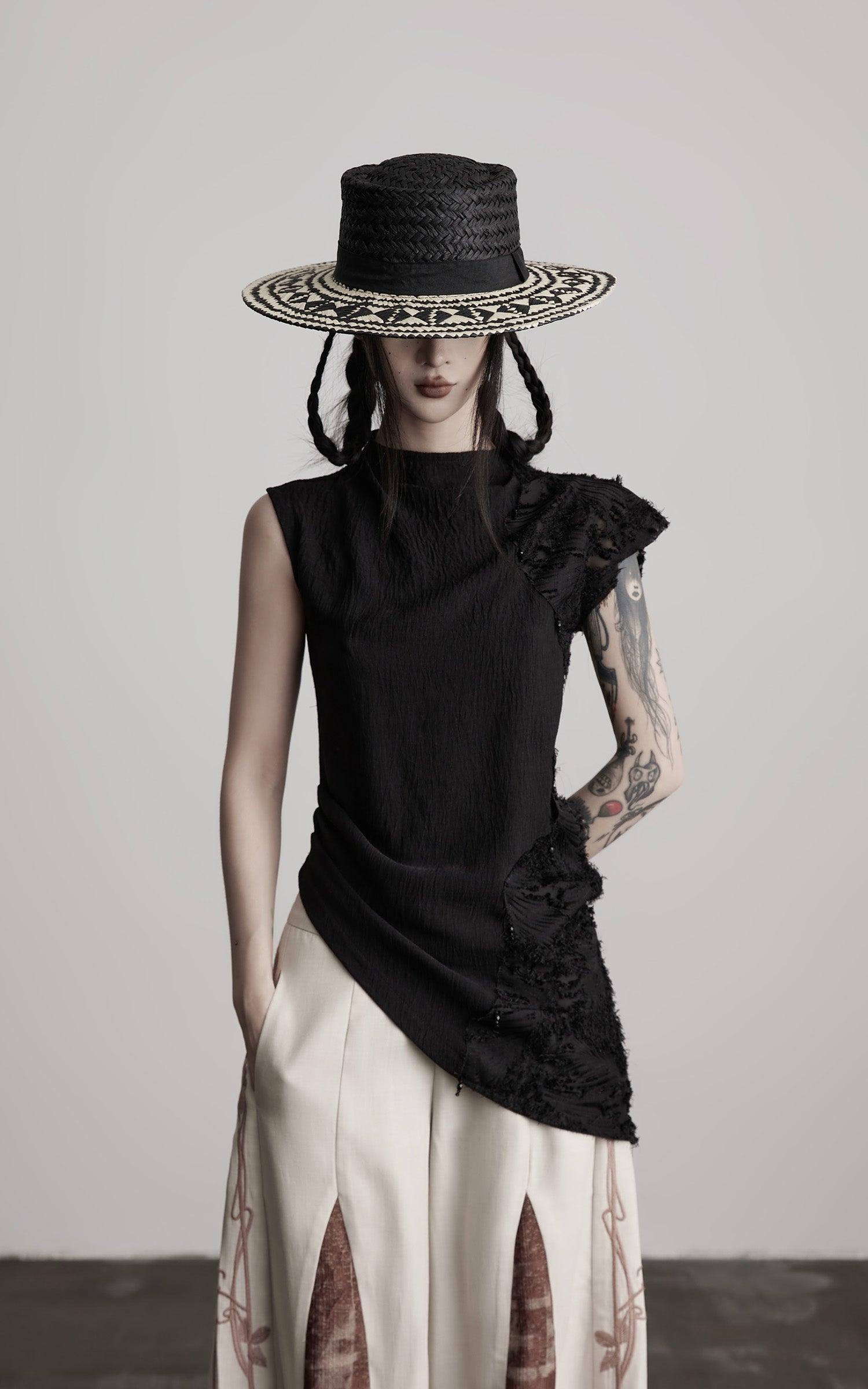 DOINDULGE Asymmetric Textured Sleeveless Top with Frayed and Beaded Detailing
