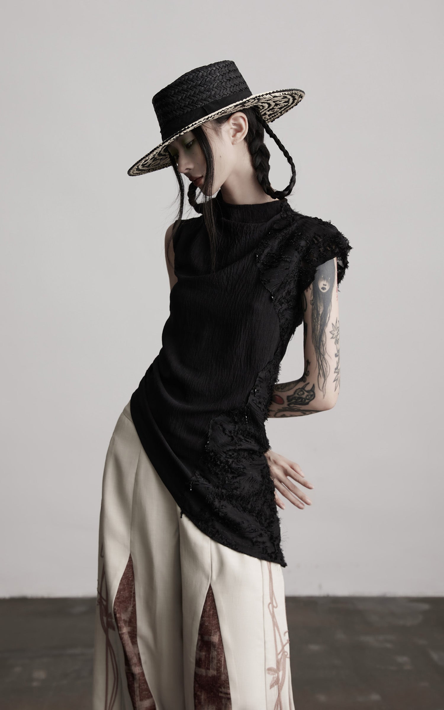 DOINDULGE Asymmetric Textured Sleeveless Top with Frayed and Beaded Detailing