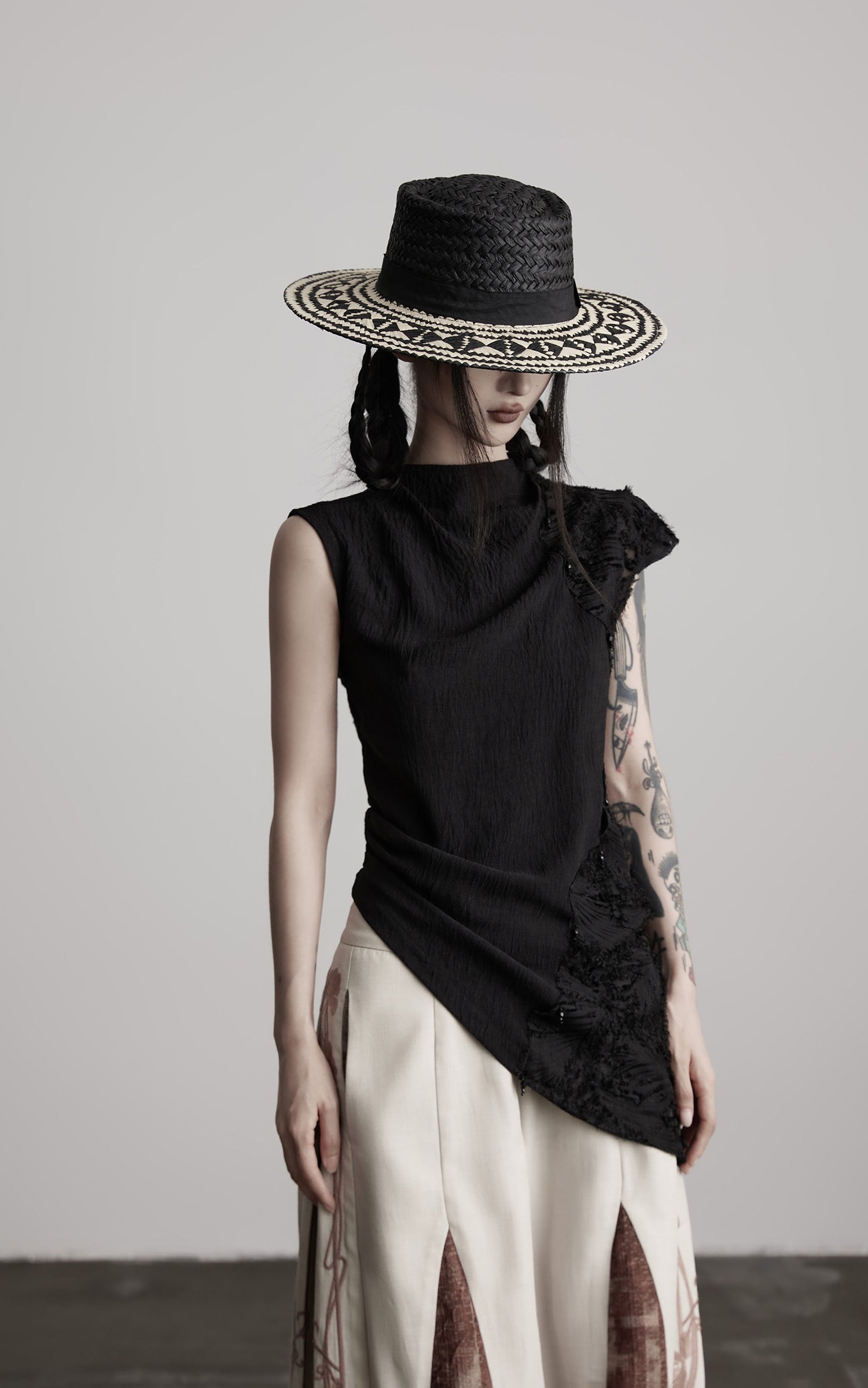 DOINDULGE Asymmetric Textured Sleeveless Top with Frayed and Beaded Detailing