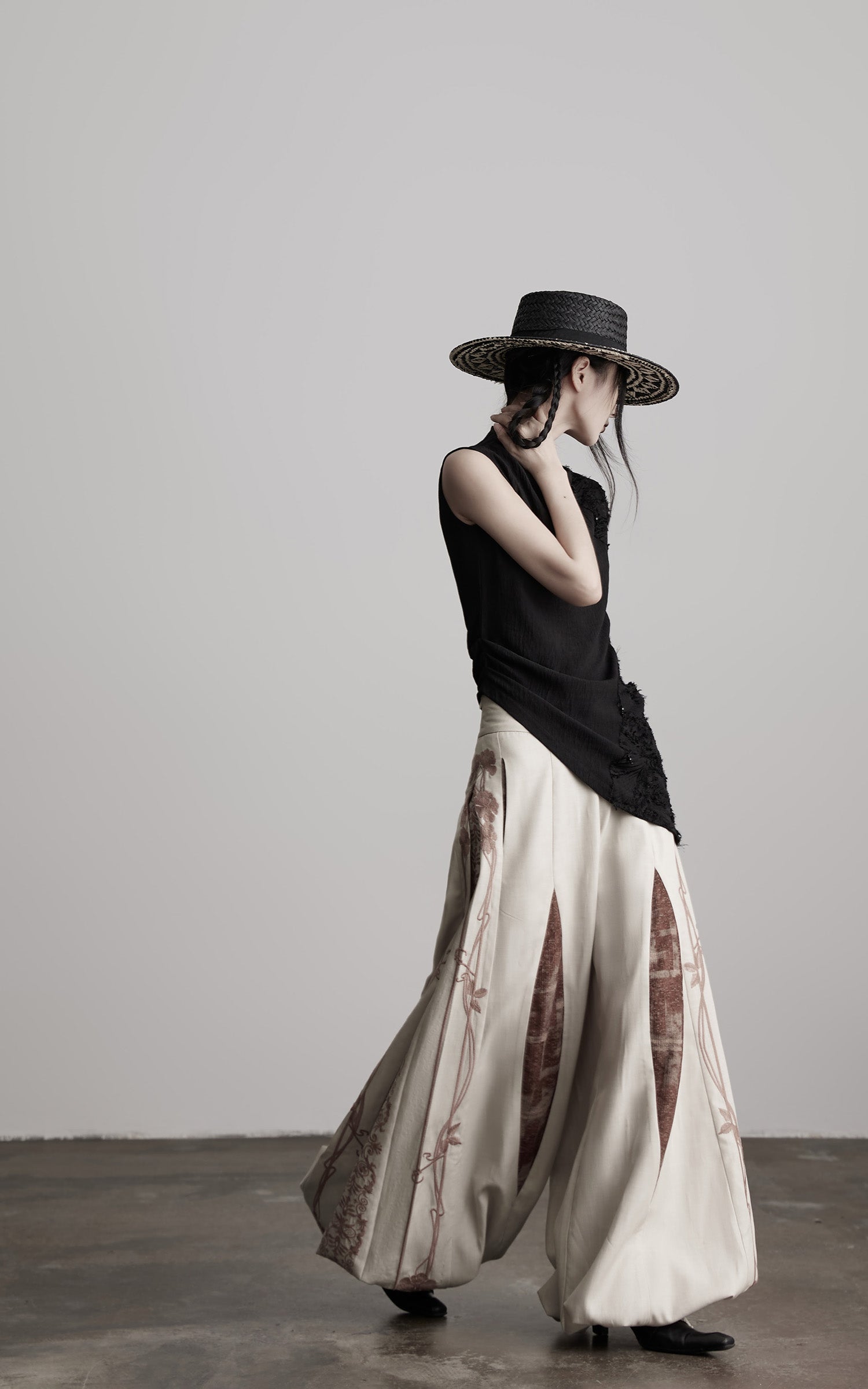 DOINDULGE Asymmetric Textured Sleeveless Top with Frayed and Beaded Detailing