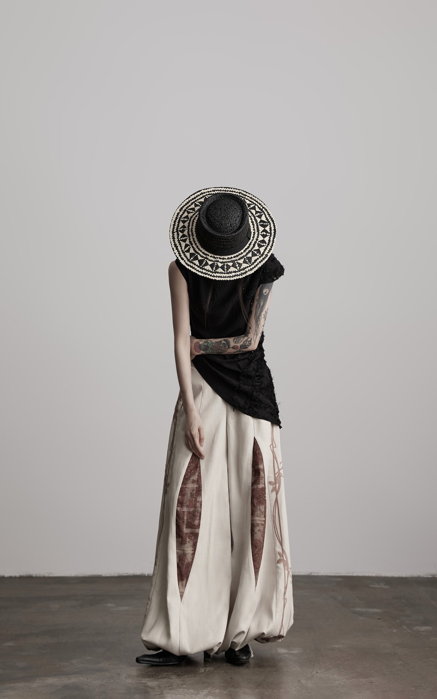 DOINDULGE Asymmetric Textured Sleeveless Top with Frayed and Beaded Detailing