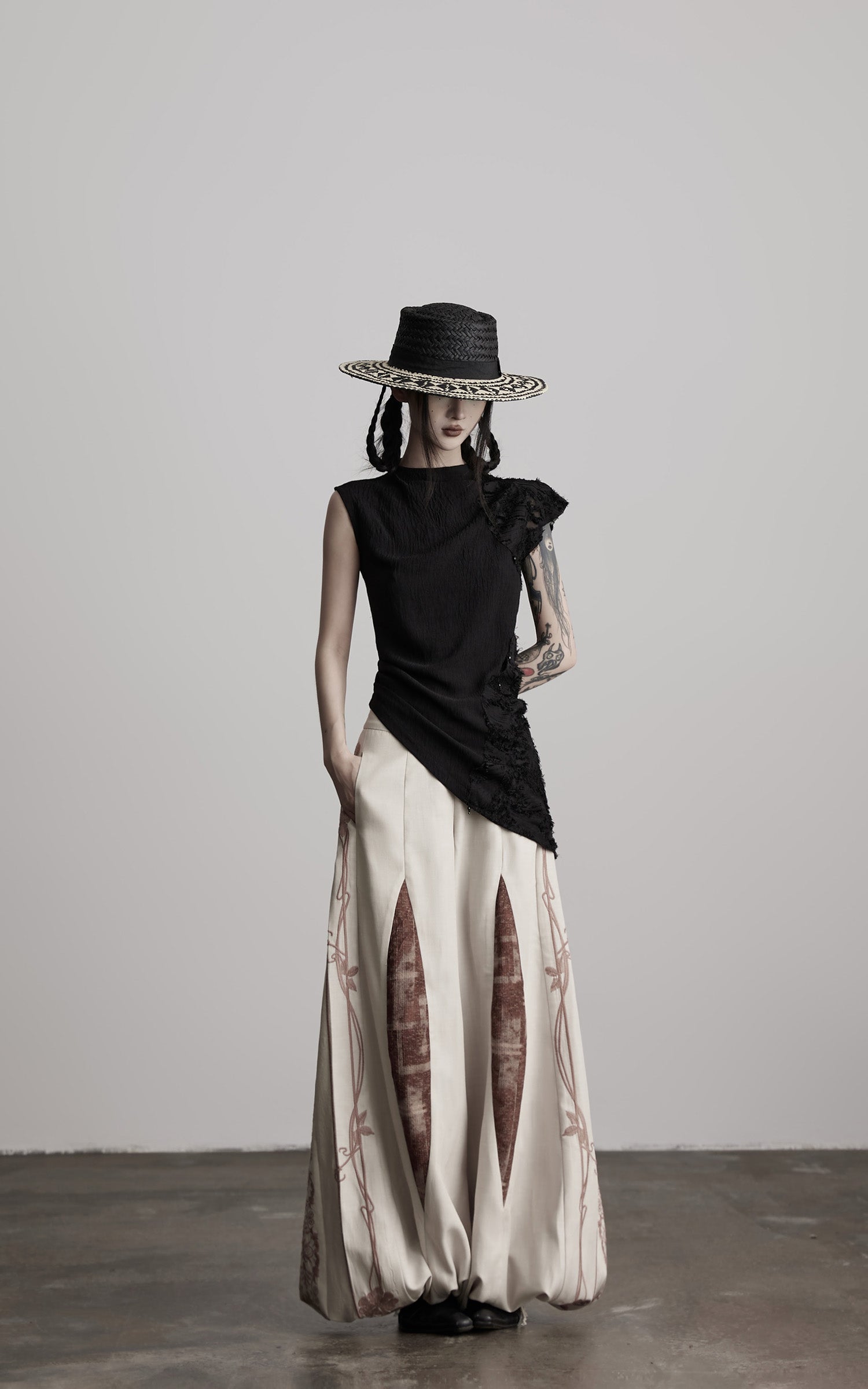 DOINDULGE Asymmetric Textured Sleeveless Top with Frayed and Beaded Detailing