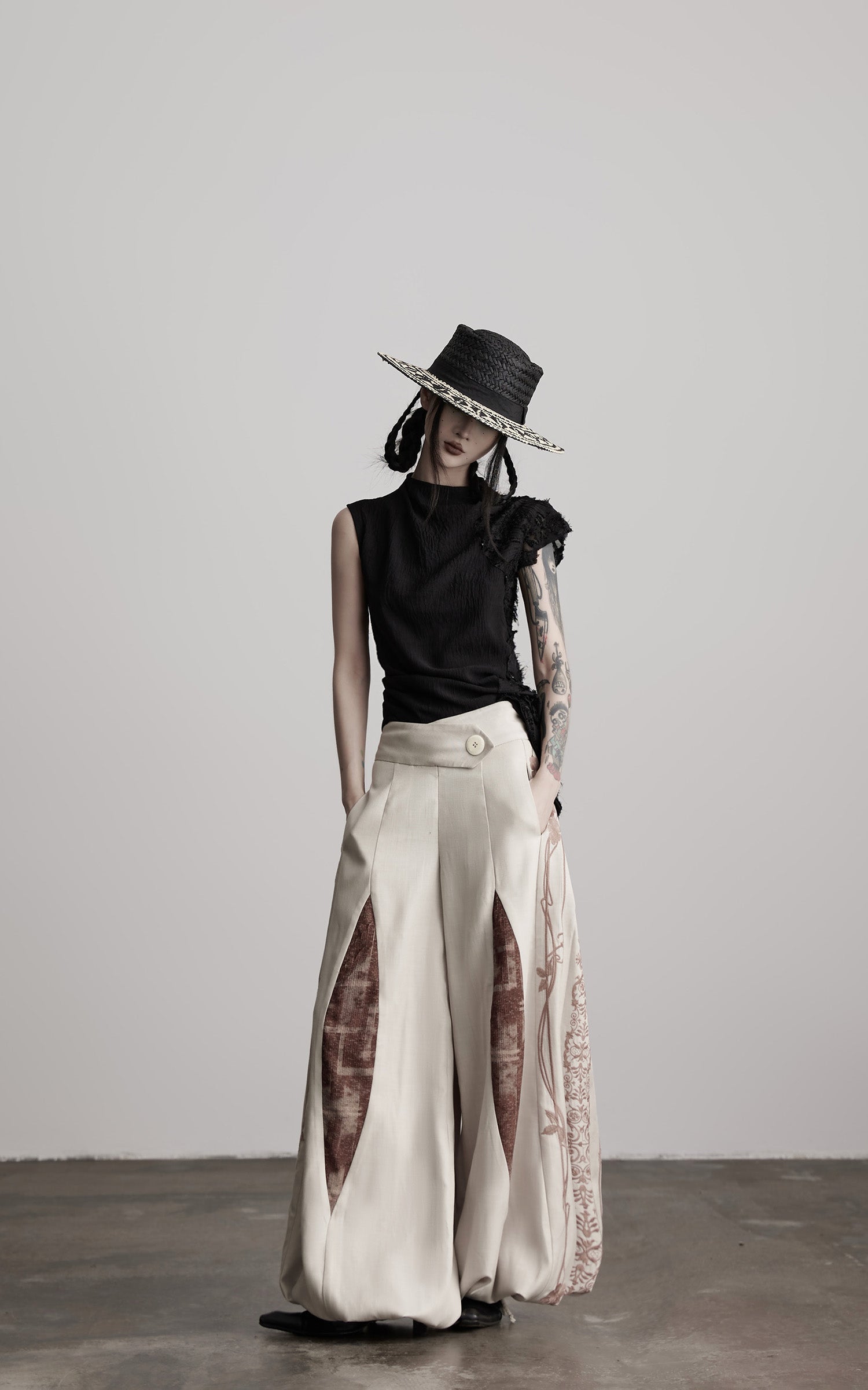 DOINDULGE Asymmetric Textured Sleeveless Top with Frayed and Beaded Detailing