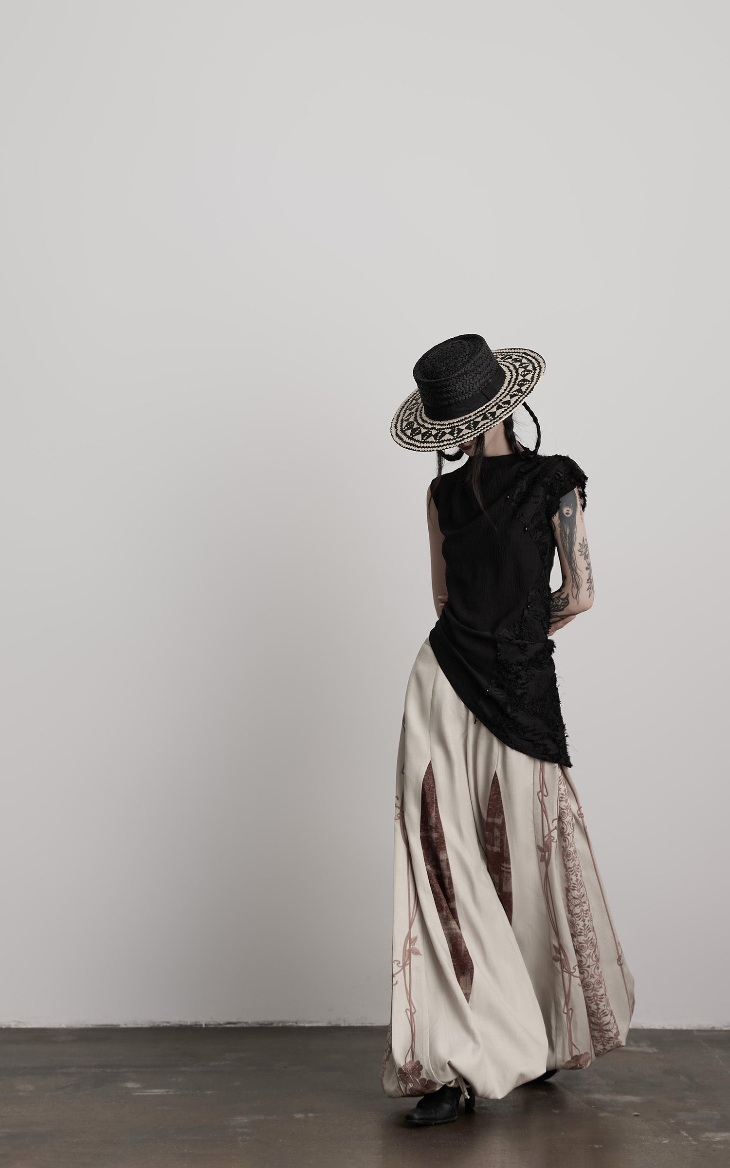 DOINDULGE Asymmetric Textured Sleeveless Top with Frayed and Beaded Detailing