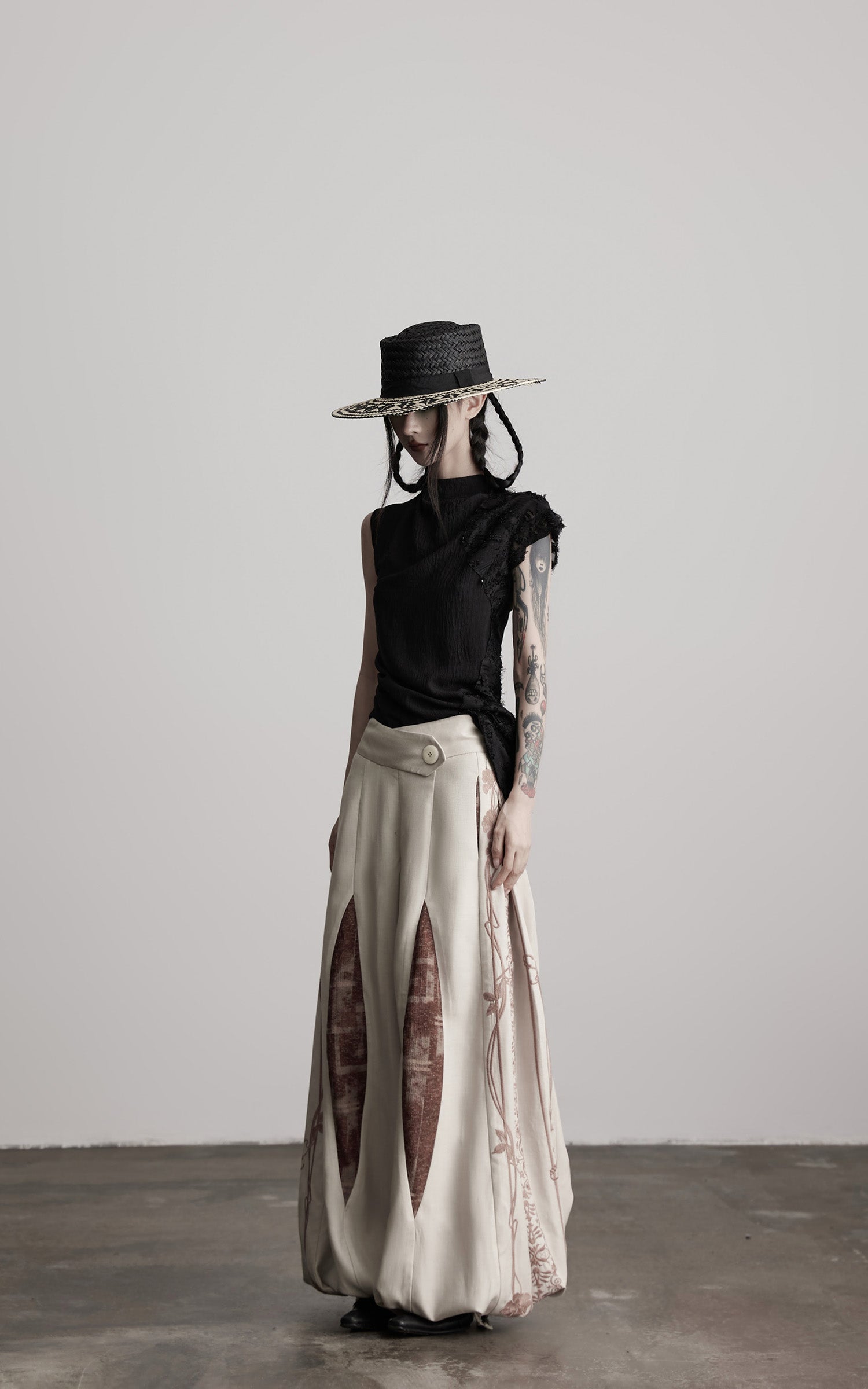 DOINDULGE Asymmetric Textured Sleeveless Top with Frayed and Beaded Detailing
