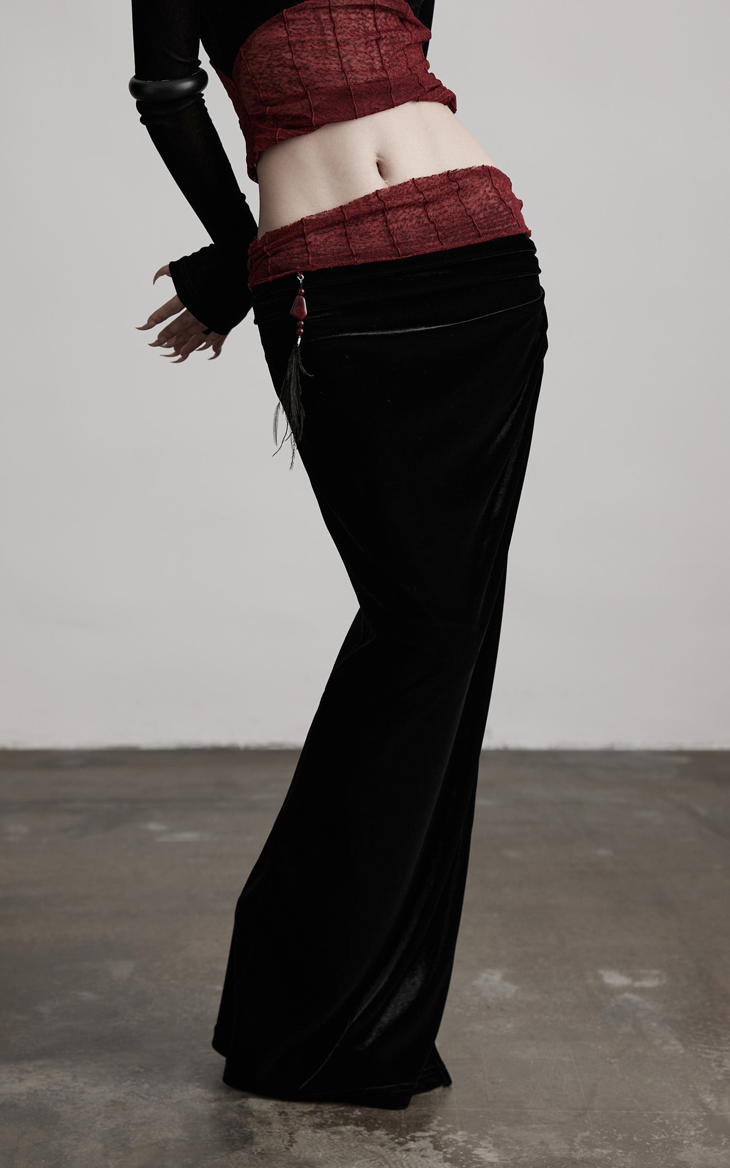 DOINDULGE Draped Velvet Skirt with Sheer Red Waist Detail