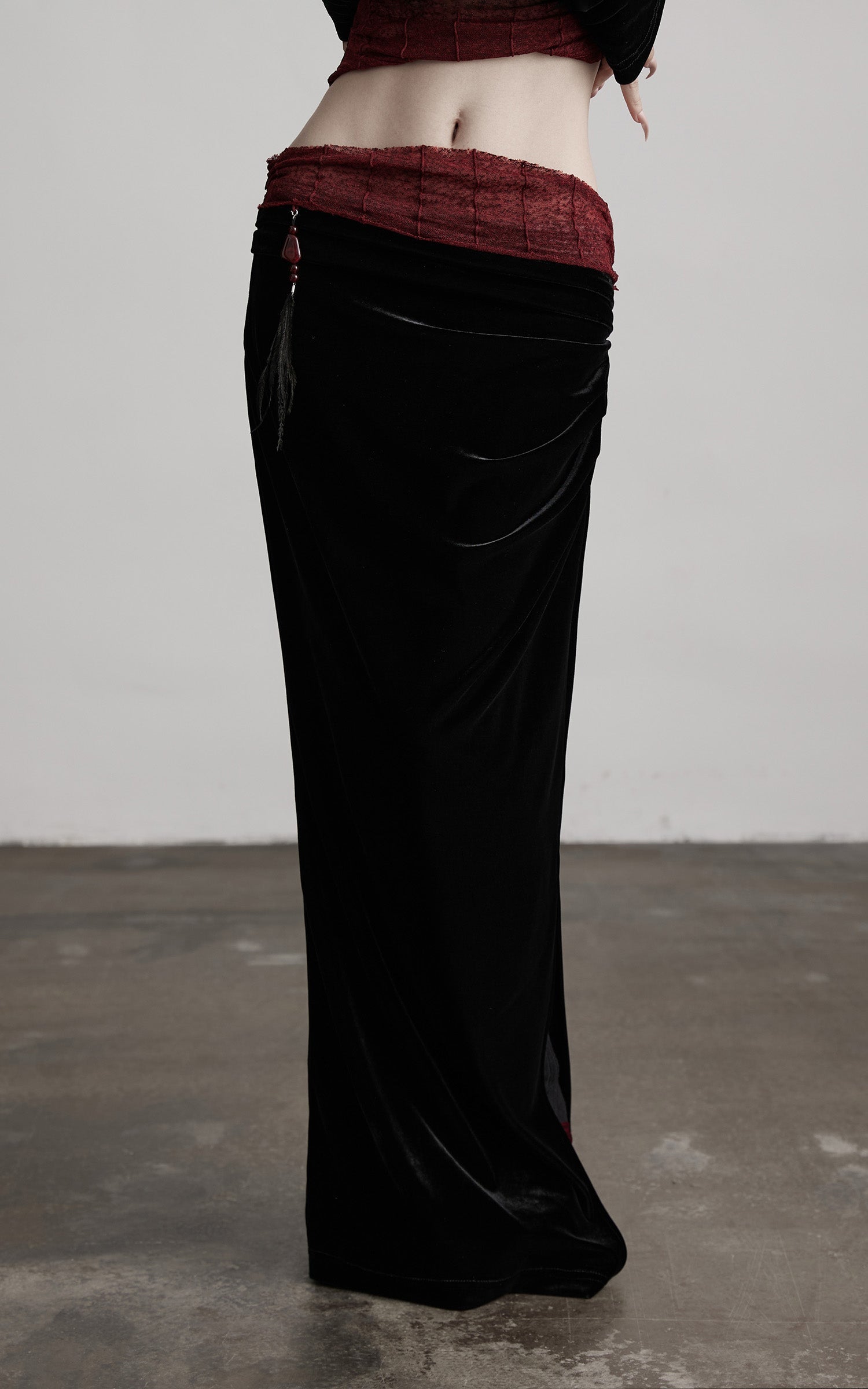 DOINDULGE Draped Velvet Skirt with Sheer Red Waist Detail