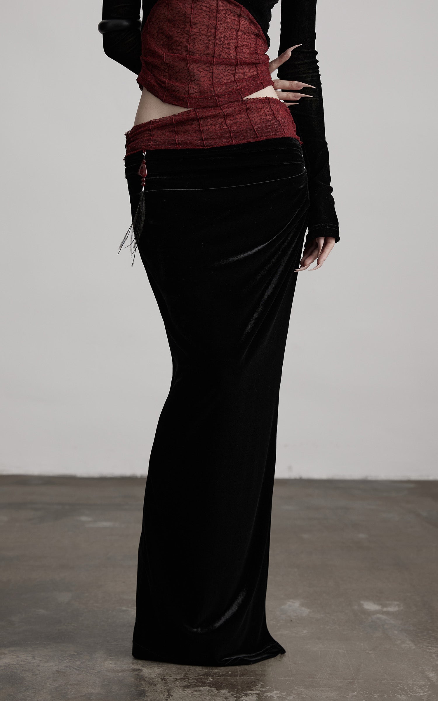 DOINDULGE Draped Velvet Skirt with Sheer Red Waist Detail