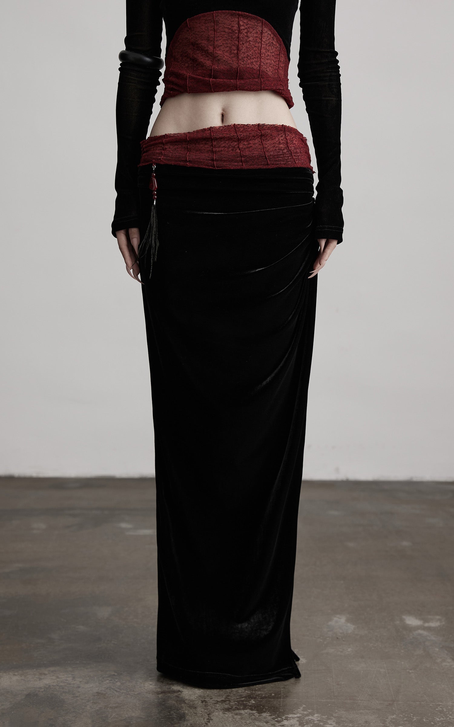 DOINDULGE Draped Velvet Skirt with Sheer Red Waist Detail