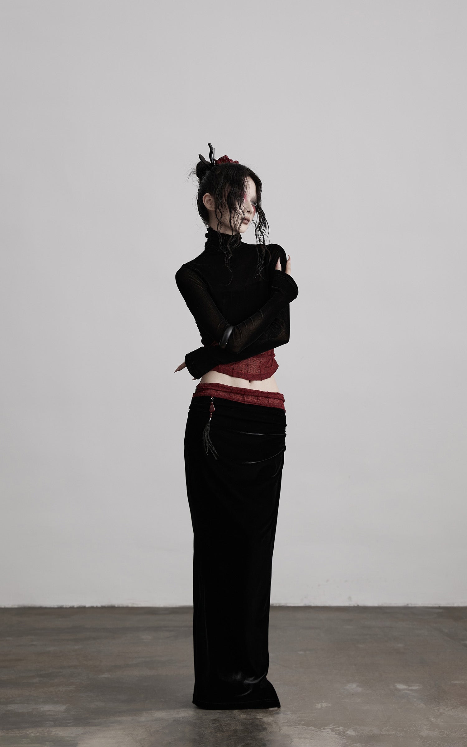 DOINDULGE Draped Velvet Skirt with Sheer Red Waist Detail
