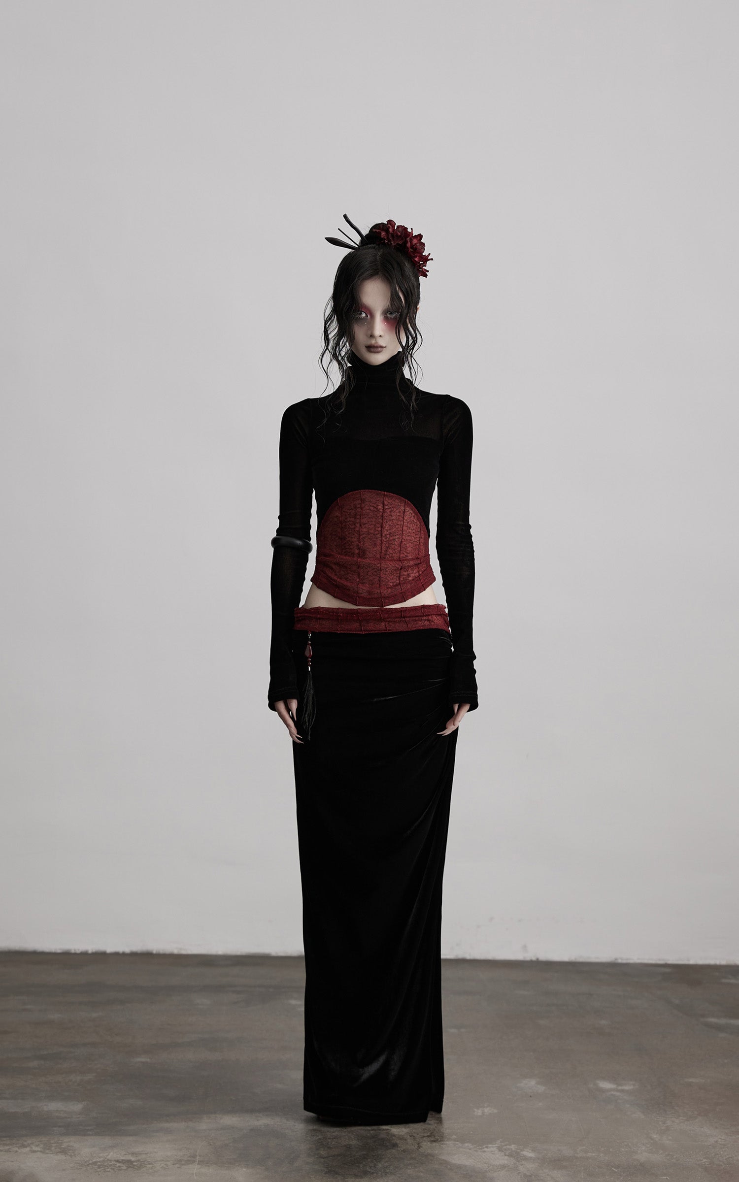 DOINDULGE Draped Velvet Skirt with Sheer Red Waist Detail