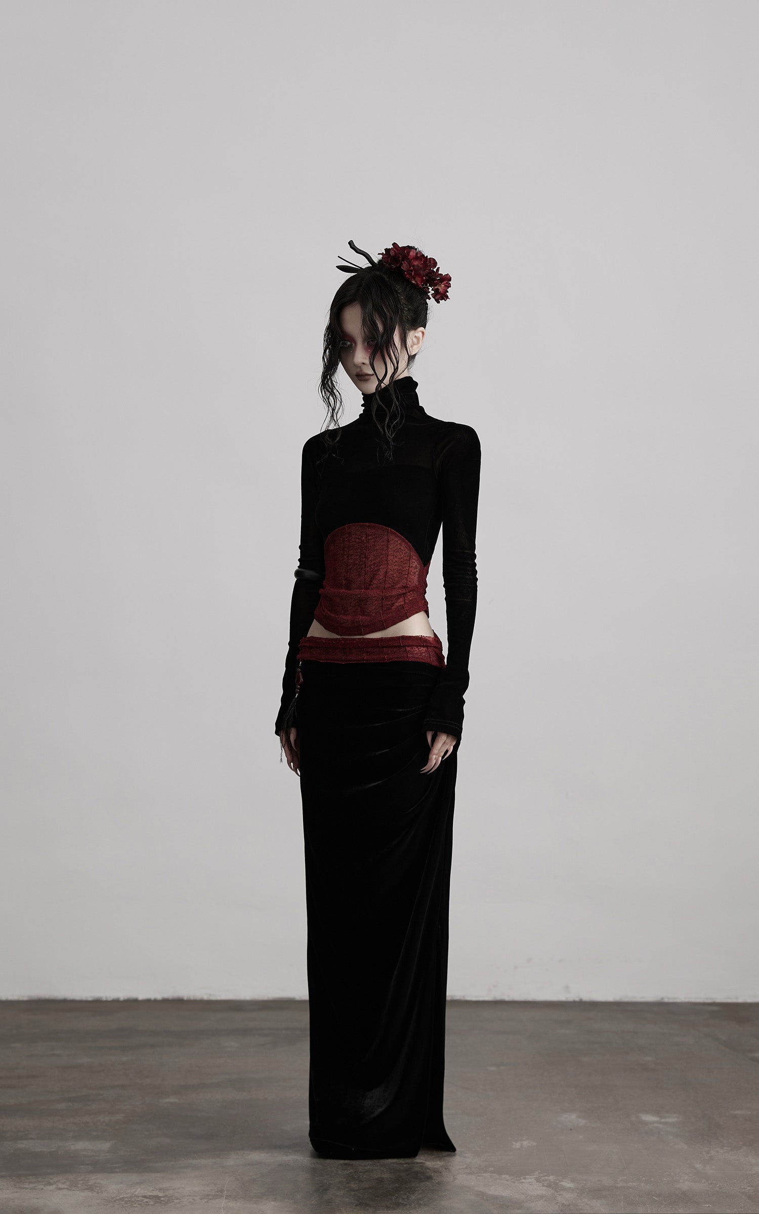 DOINDULGE Draped Velvet Skirt with Sheer Red Waist Detail
