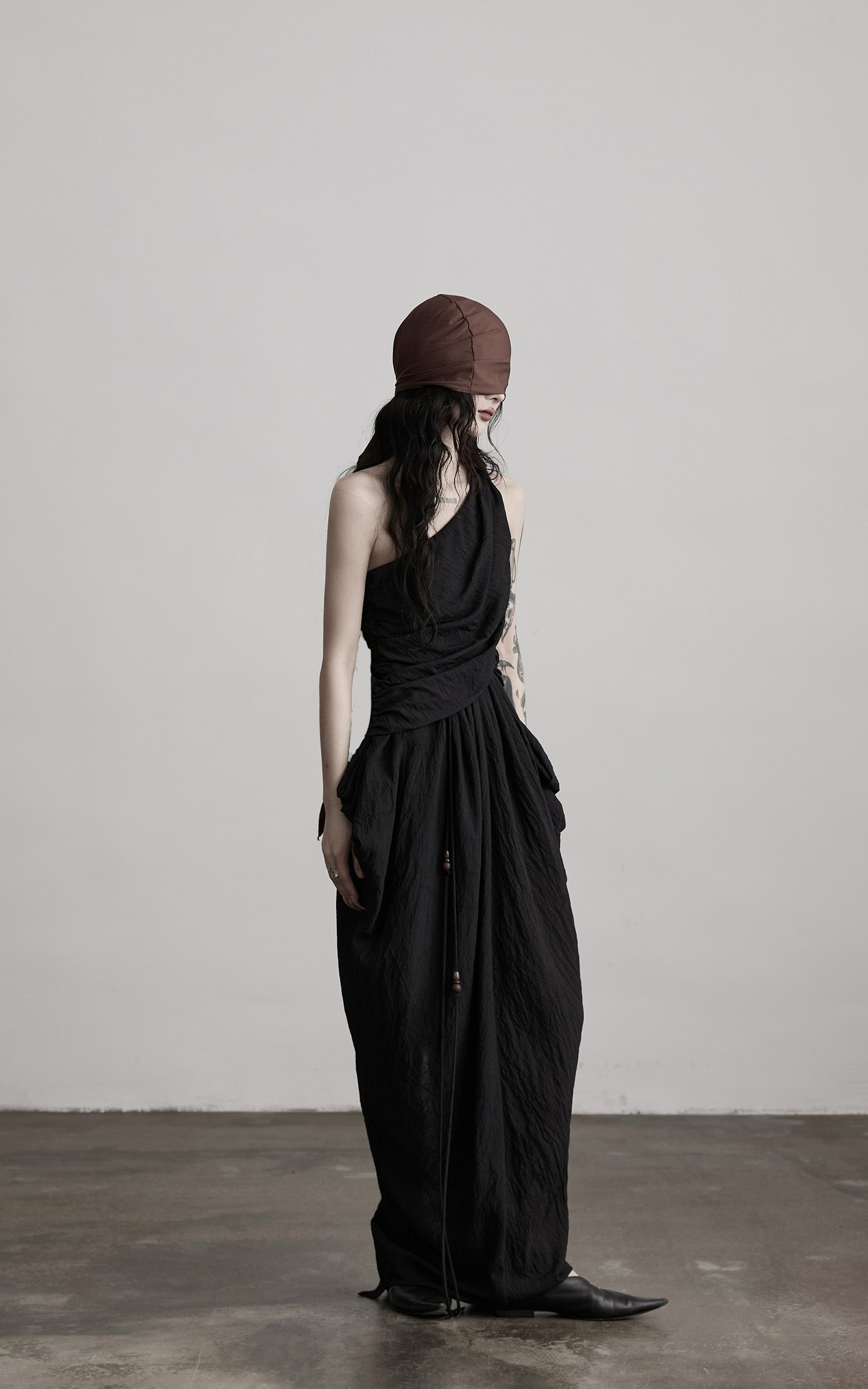 DOINDULGE Asymmetric Draped Maxi Dress with Textured Fabric and Wooden Bead Detail