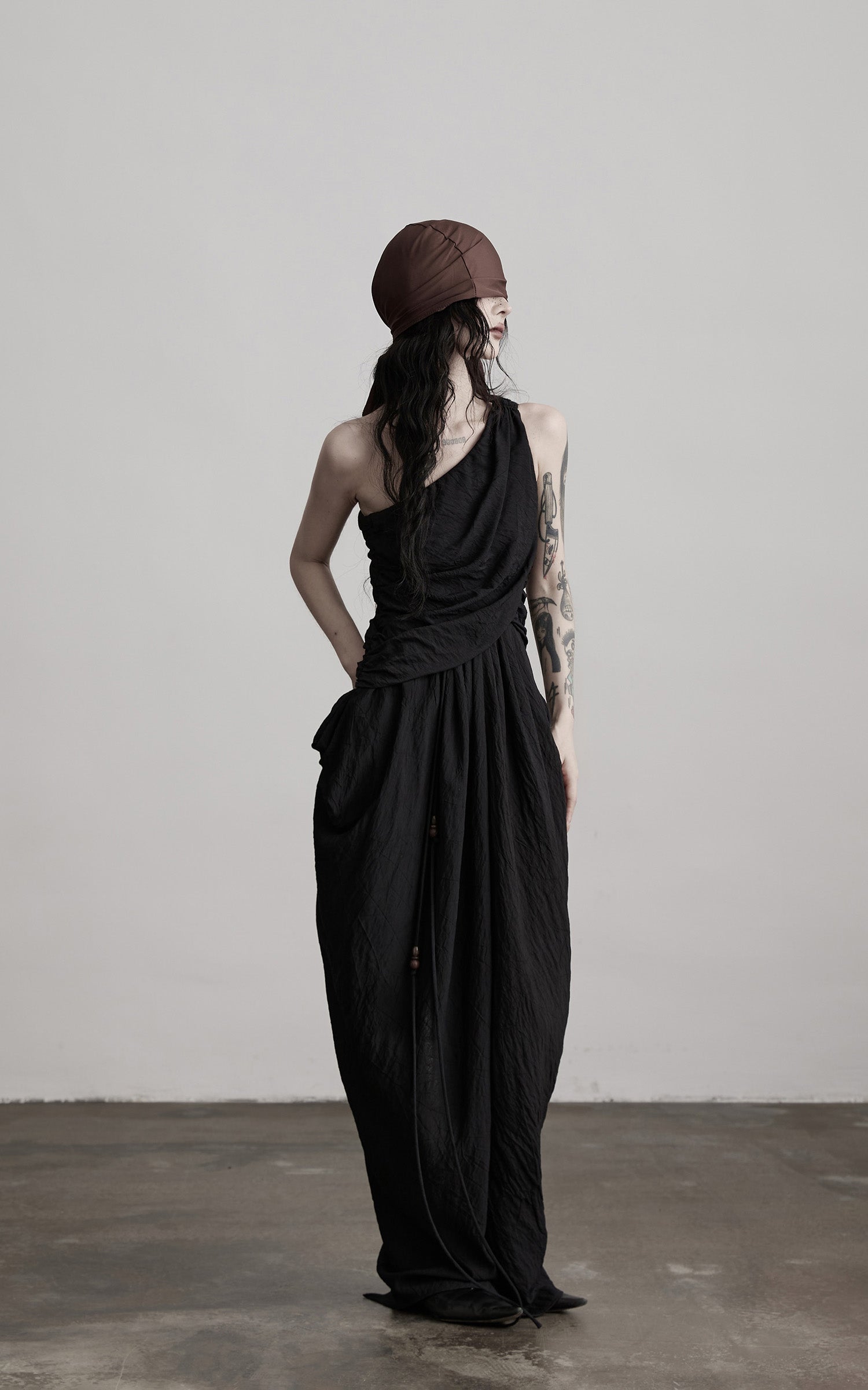 DOINDULGE Asymmetric Draped Maxi Dress with Textured Fabric and Wooden Bead Detail