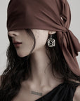 DOINDULGE Asymmetric Draped Maxi Dress with Textured Fabric and Wooden Bead Detail
