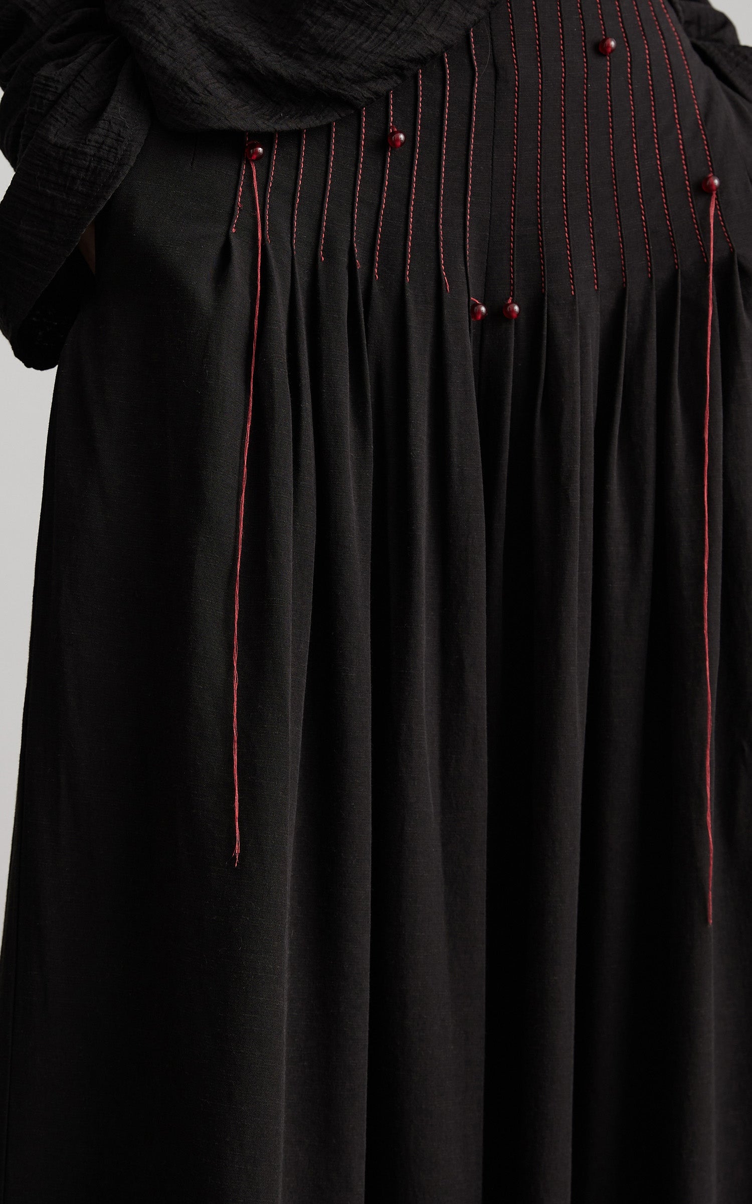 DOINDULGE Wide-Leg Trousers with Red Stitch Detailing