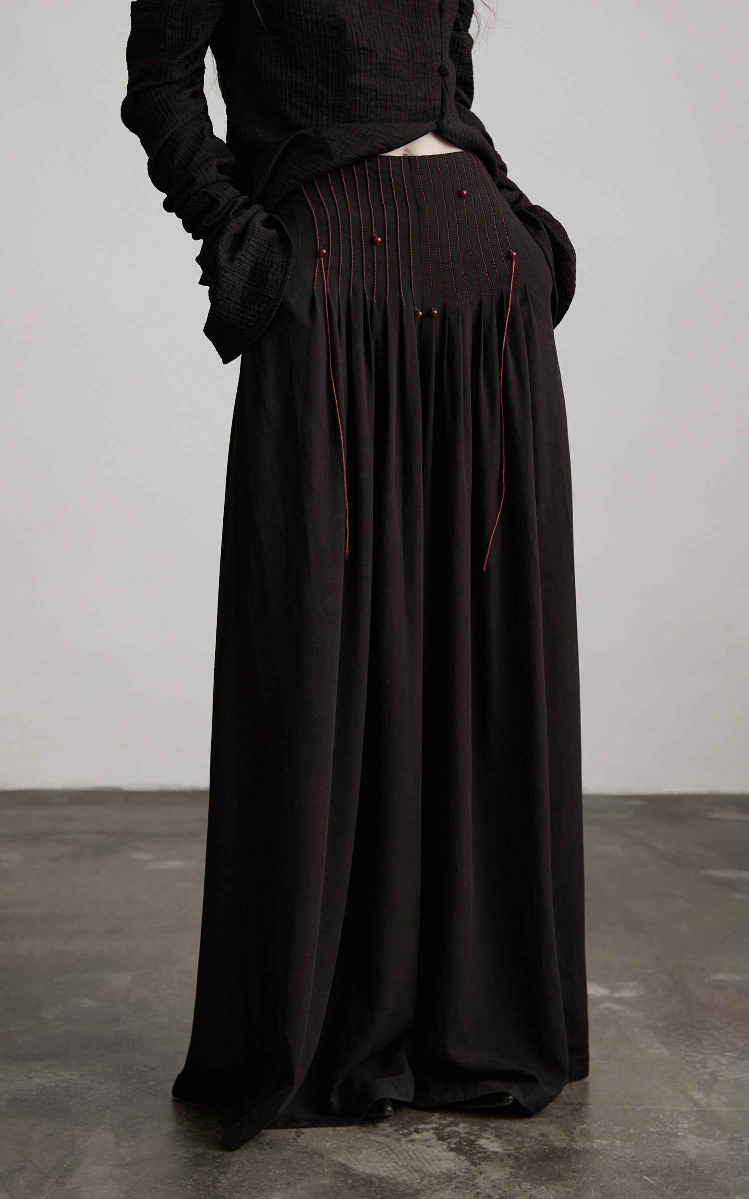 DOINDULGE Wide-Leg Trousers with Red Stitch Detailing