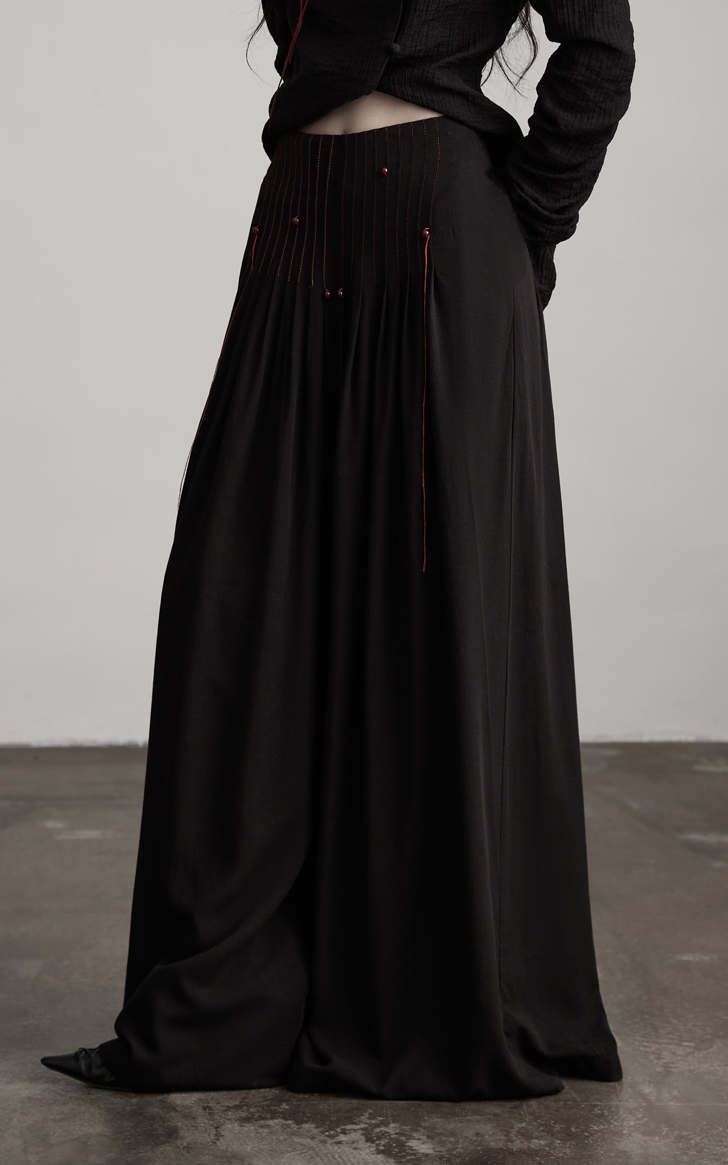 DOINDULGE Wide-Leg Trousers with Red Stitch Detailing