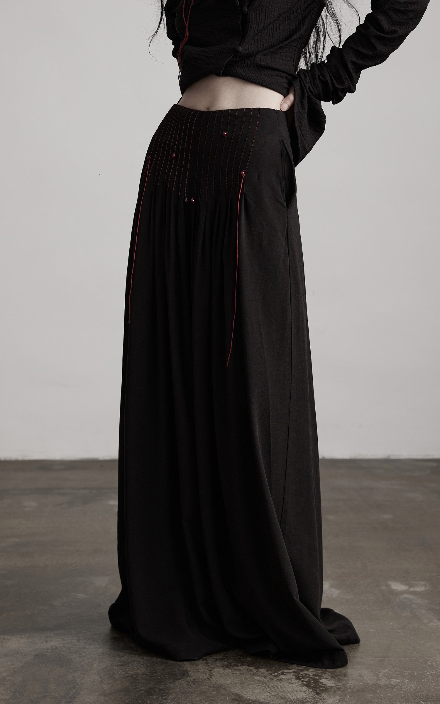 DOINDULGE Wide-Leg Trousers with Red Stitch Detailing