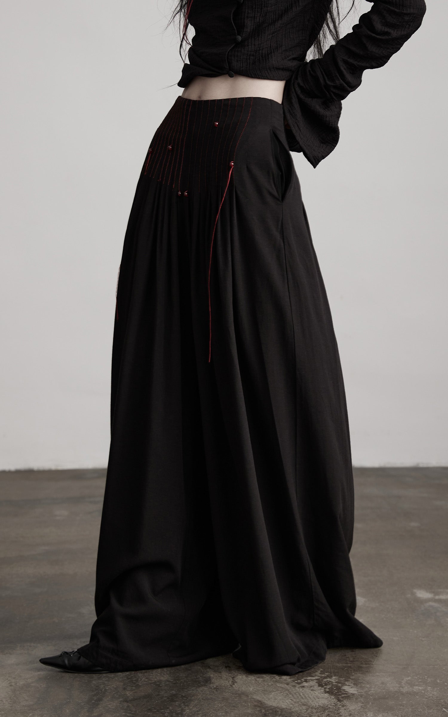 DOINDULGE Wide-Leg Trousers with Red Stitch Detailing