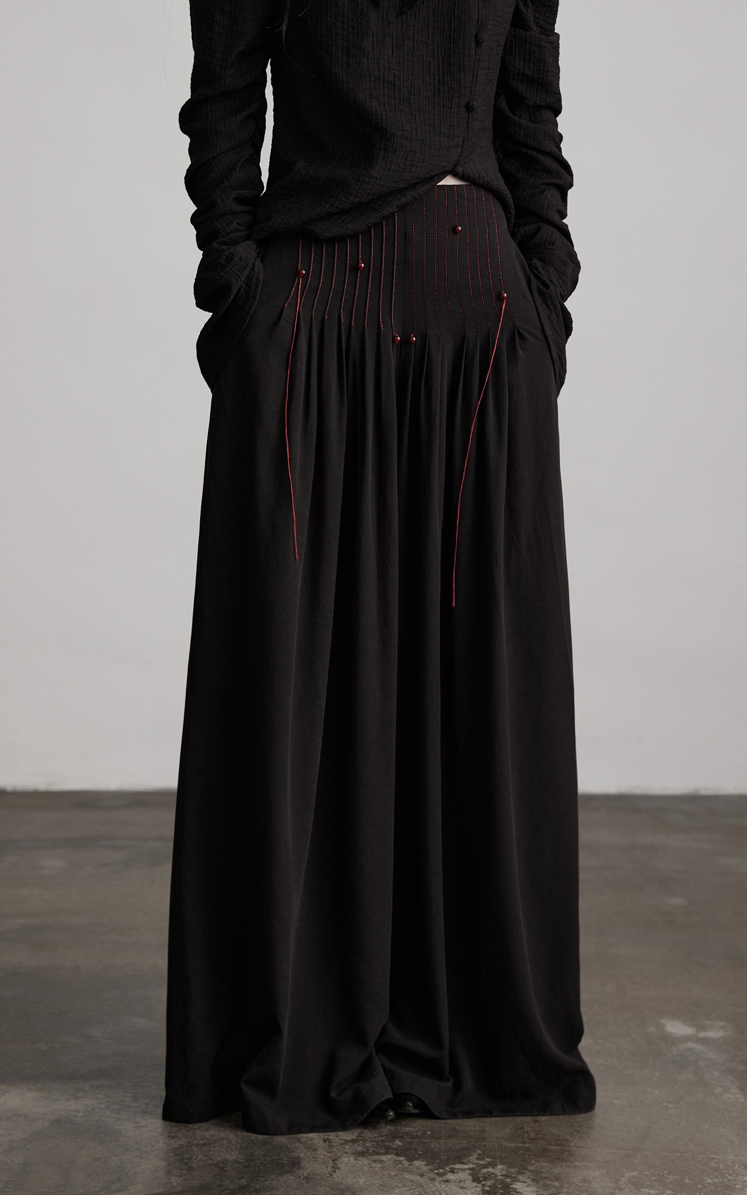 DOINDULGE Wide-Leg Trousers with Red Stitch Detailing