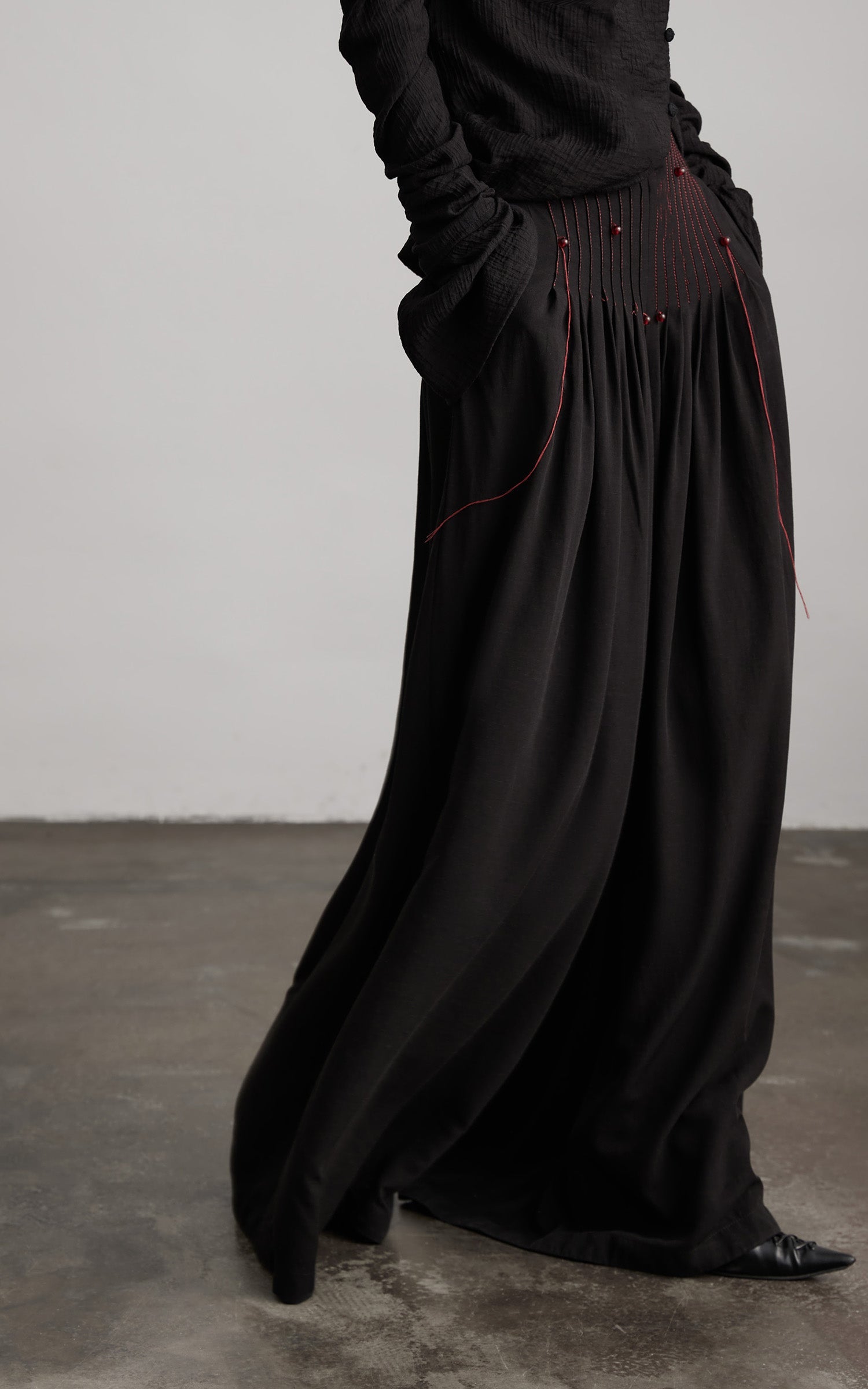 DOINDULGE Wide-Leg Trousers with Red Stitch Detailing