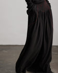 DOINDULGE Wide-Leg Trousers with Red Stitch Detailing