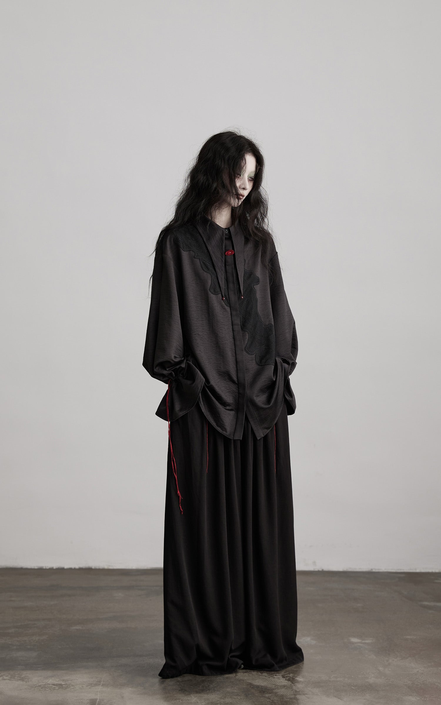 DOINDULGE Wide-Leg Trousers with Red Stitch Detailing