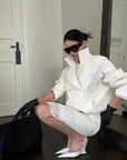 ROVENTE Cropped Double-Breasted Trench Jacket with Structured Lapels and Buckled Cuffs