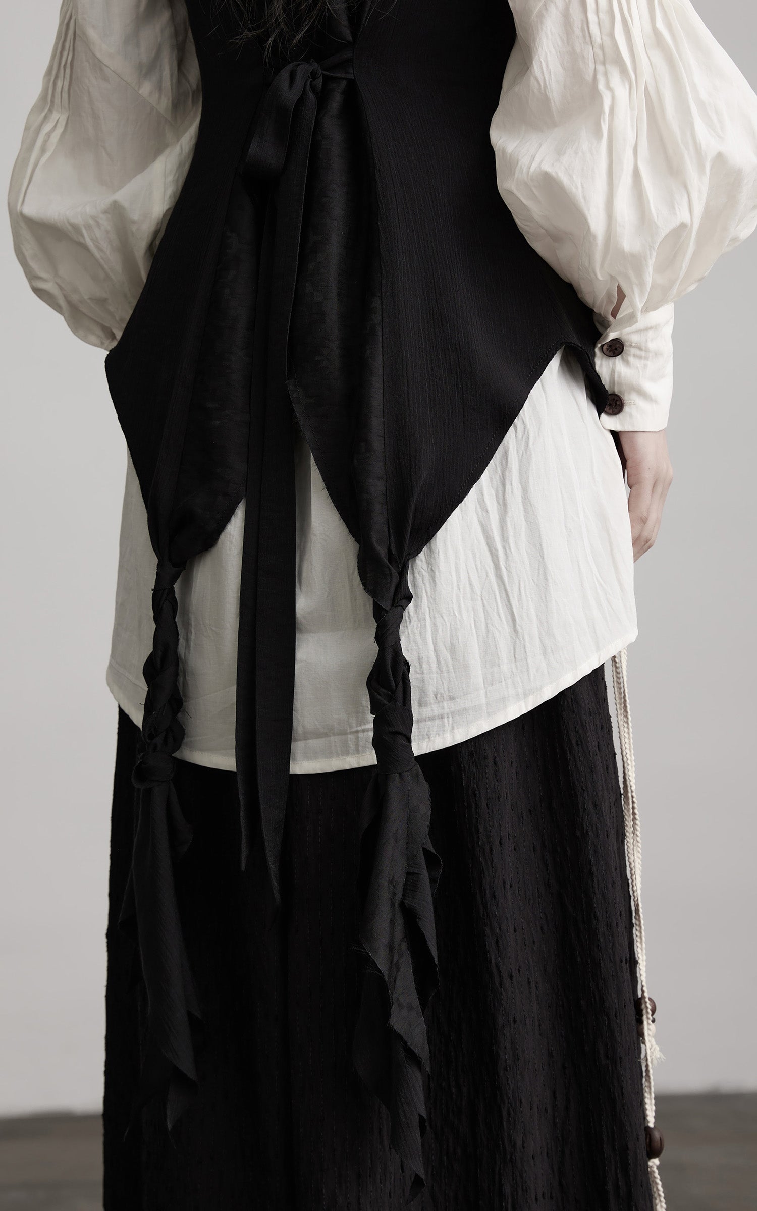 DOINDULGE Ruffled Tie Deconstructed Vest