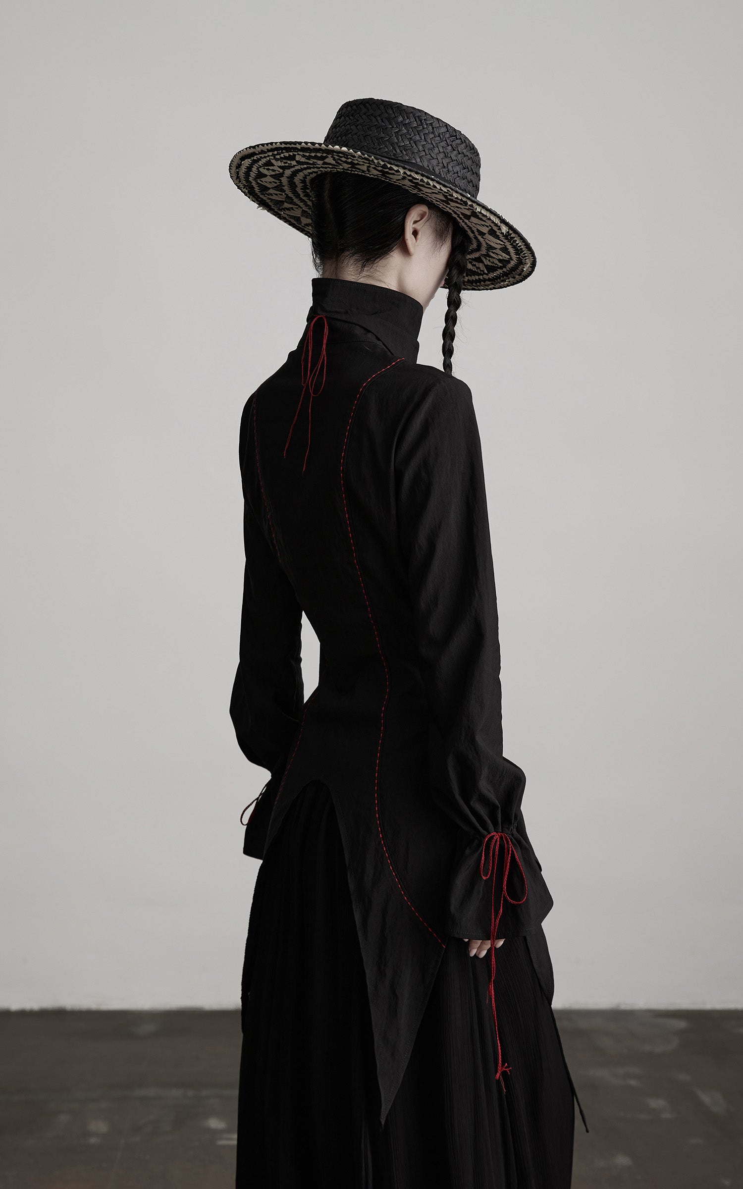 DOINDULGE Asymmetric Hem Shirt with Red Stitch Detail