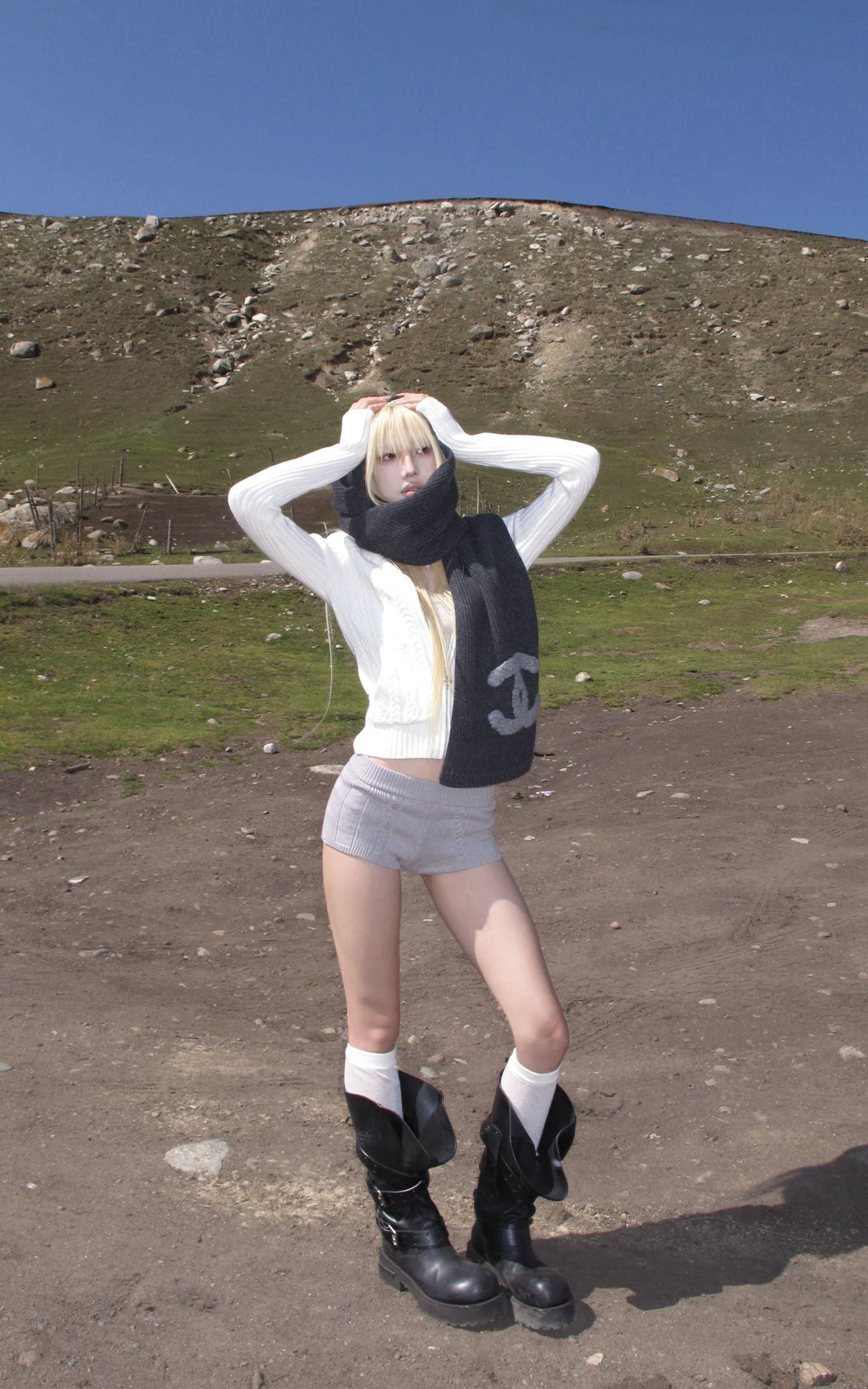 Rase le sol High Neck Cable Knit Cardigan with Sculpted Fit and Cross Zipper Detail