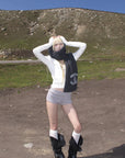 Rase le sol High Neck Cable Knit Cardigan with Sculpted Fit and Cross Zipper Detail